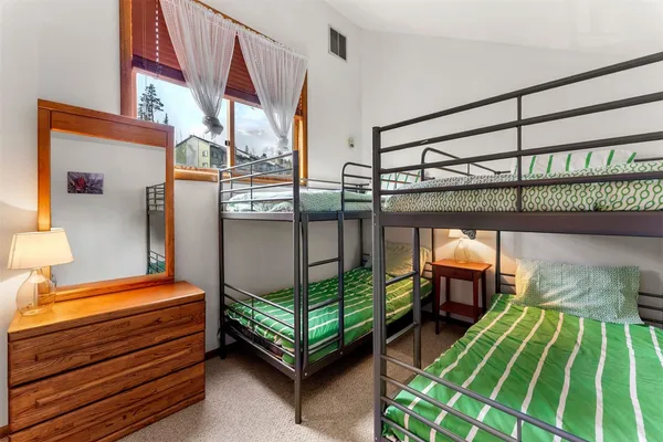 a bedroom with bunk bed