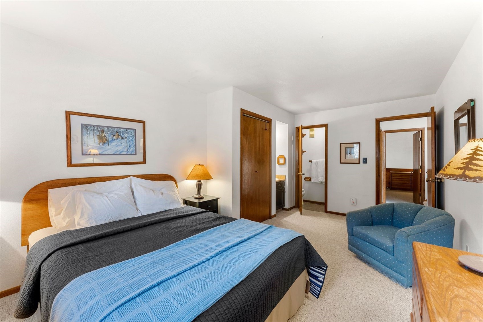 10500 Ryan Gulch Road, Unit J106 Silverthorne, CO 80498 - Photo 3 of 22 a bedroom with a bed couch and window