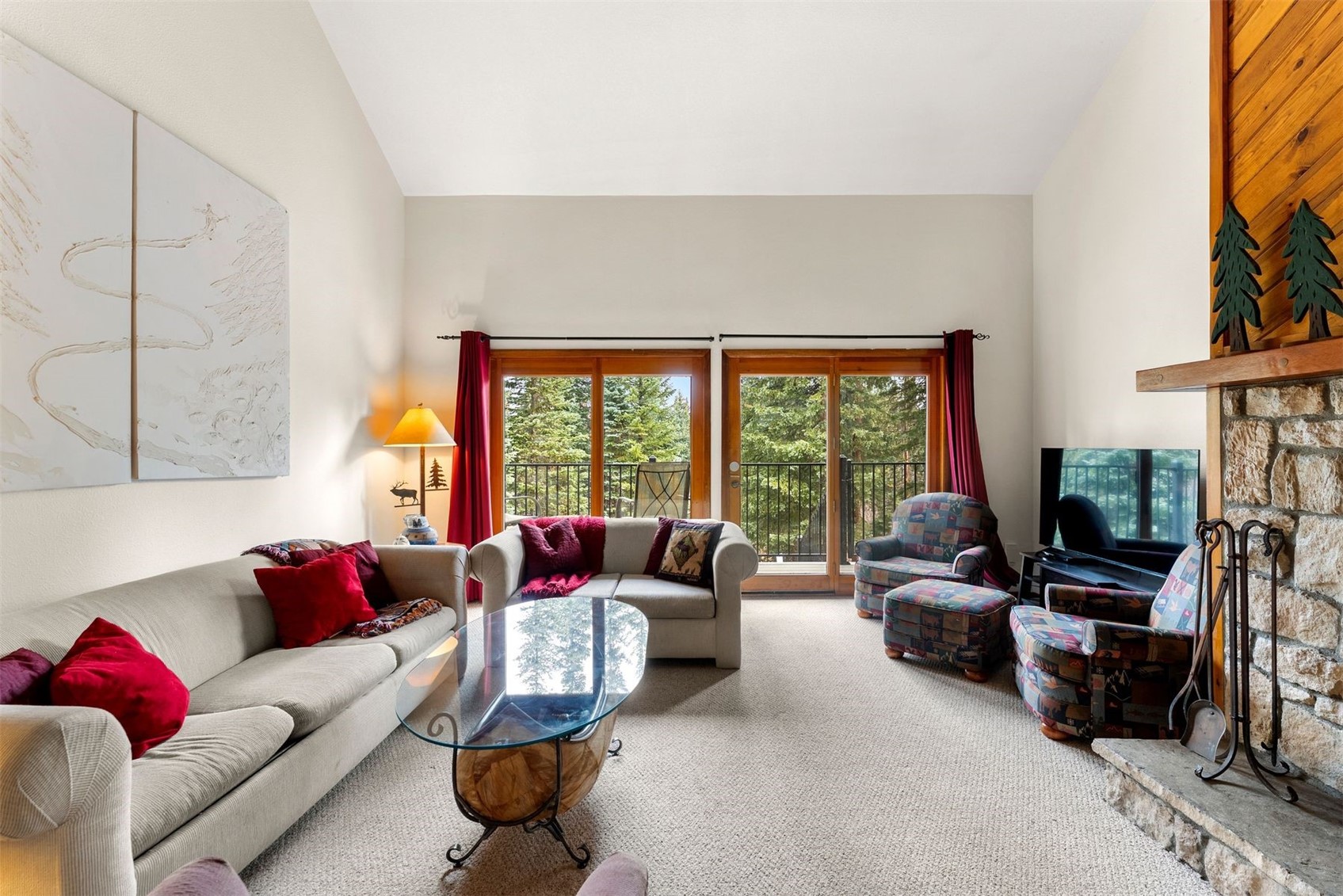 10500 Ryan Gulch Road, Unit J106 Silverthorne, CO 80498 - Photo 10 of 22 a living room with furniture and a large window