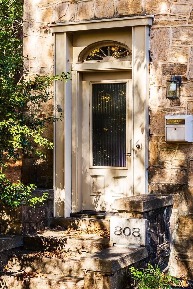 808 Williamson Drive Raleigh, NC 27608 - Photo 2 of 32 a view of a wooden house with a bench and potted plants