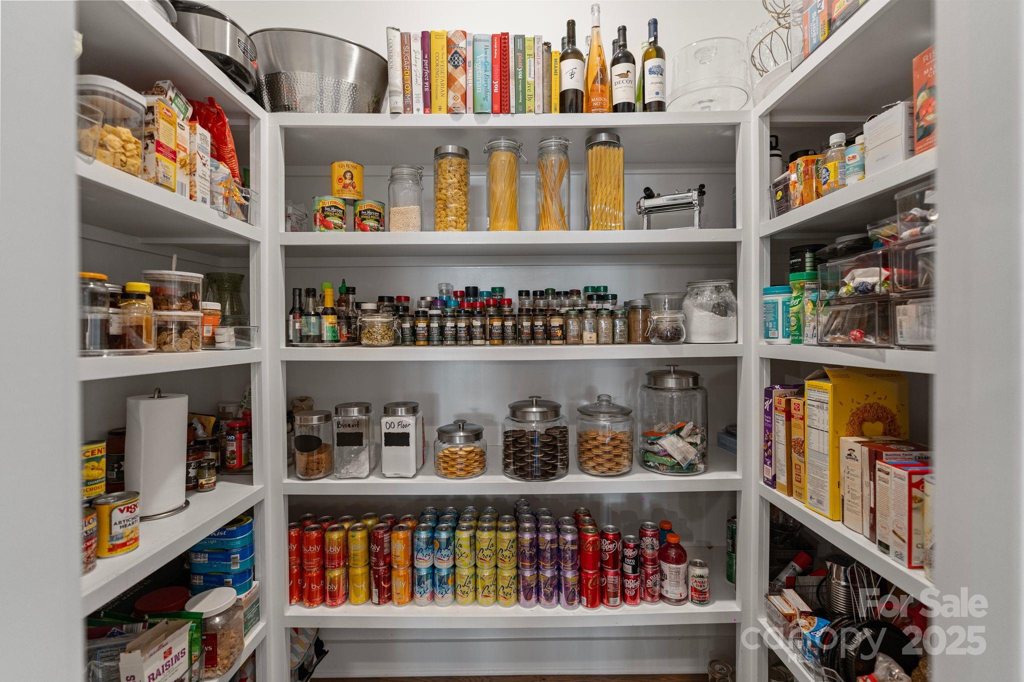 1502 Matthew McClure Circle Davidson, NC 28036 - Photo 13 of 48 a shelf with books and knick knacks on it