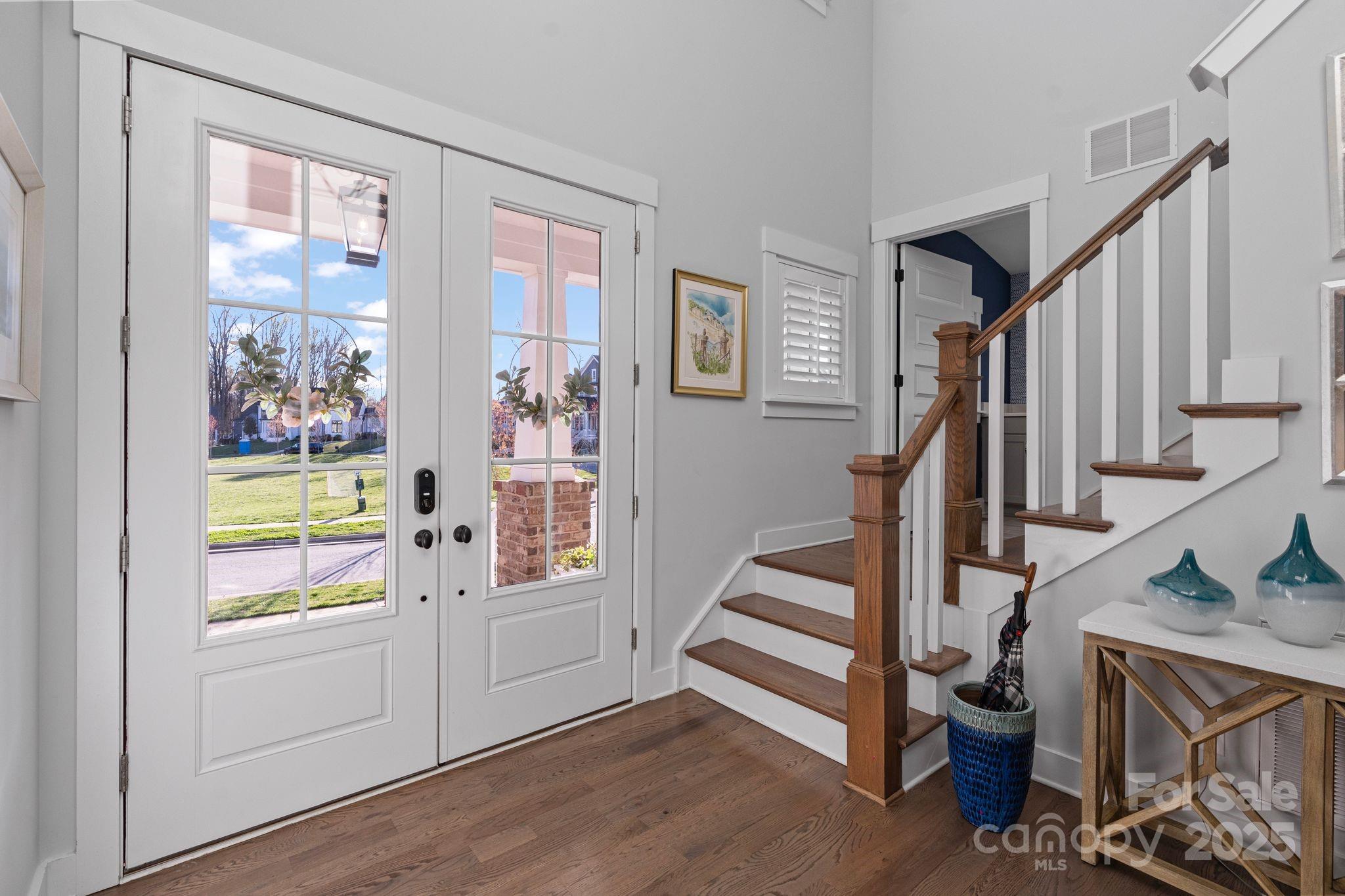 1502 Matthew McClure Circle Davidson, NC 28036 - Photo 14 of 48 a view of an entryway with wooden floor and windows