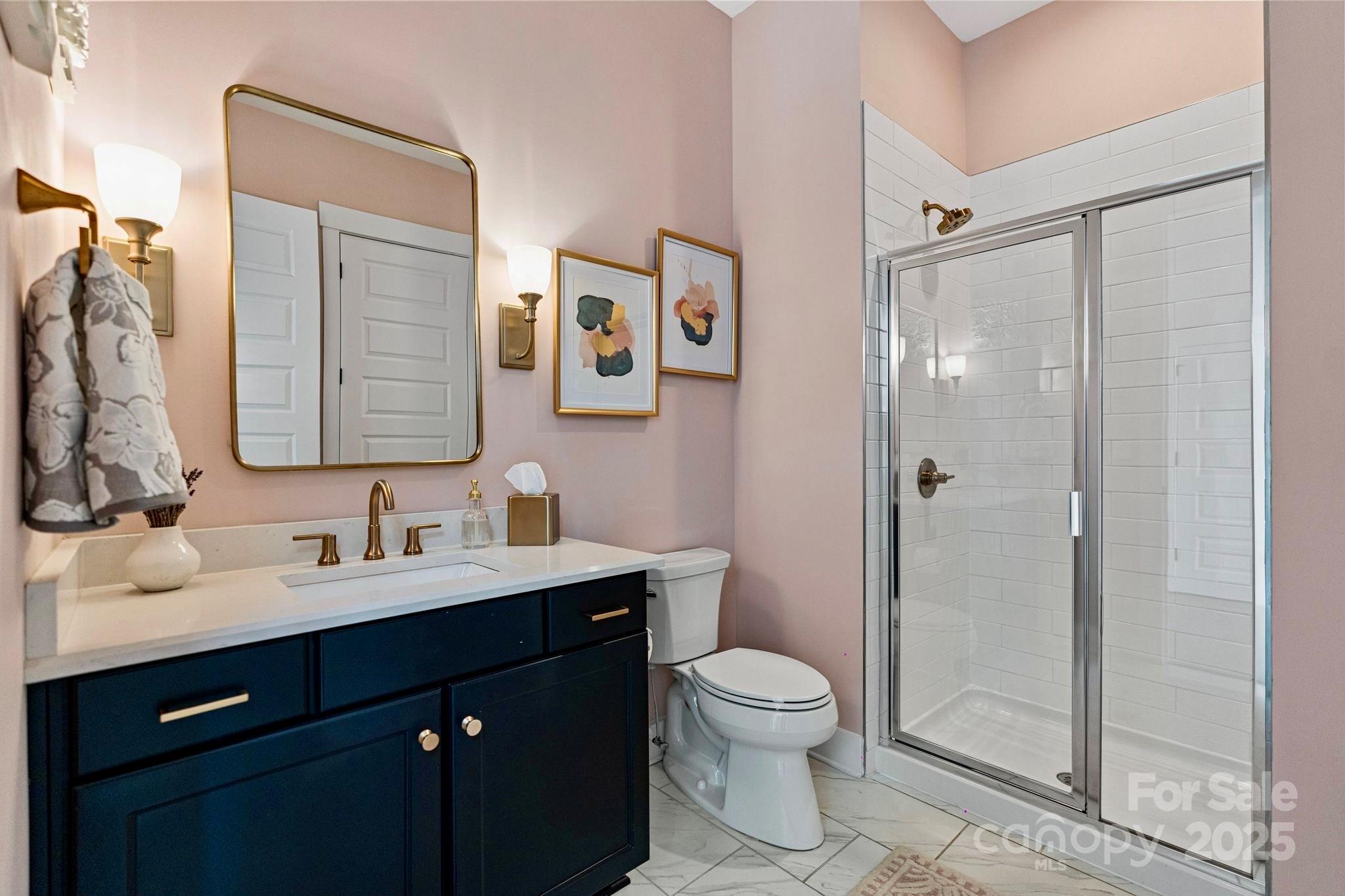 1502 Matthew McClure Circle Davidson, NC 28036 - Photo 17 of 48 a bathroom with a toilet sink a shower and a mirror