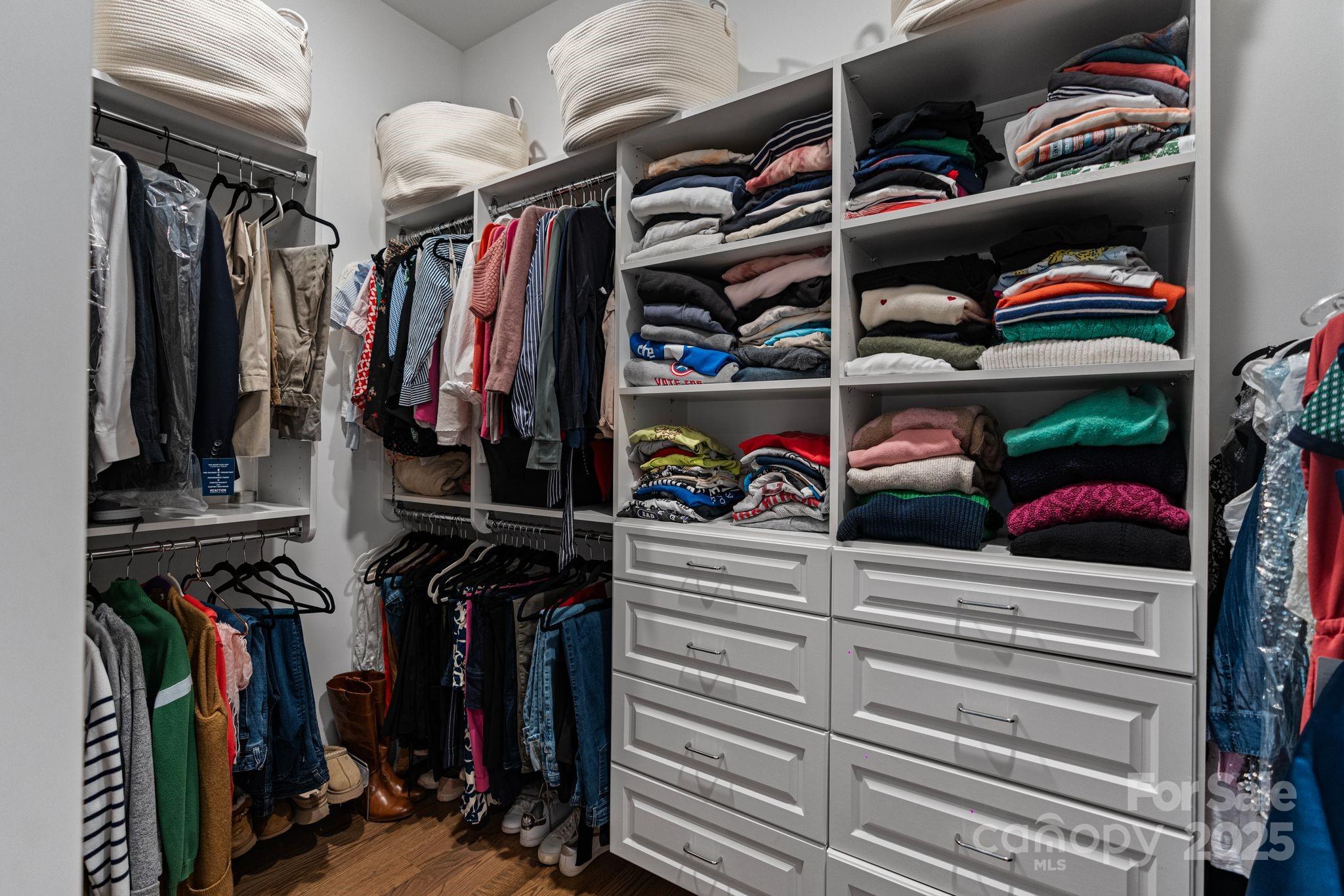 1502 Matthew McClure Circle Davidson, NC 28036 - Photo 22 of 48 a view of walk in closet with clothes and shoes