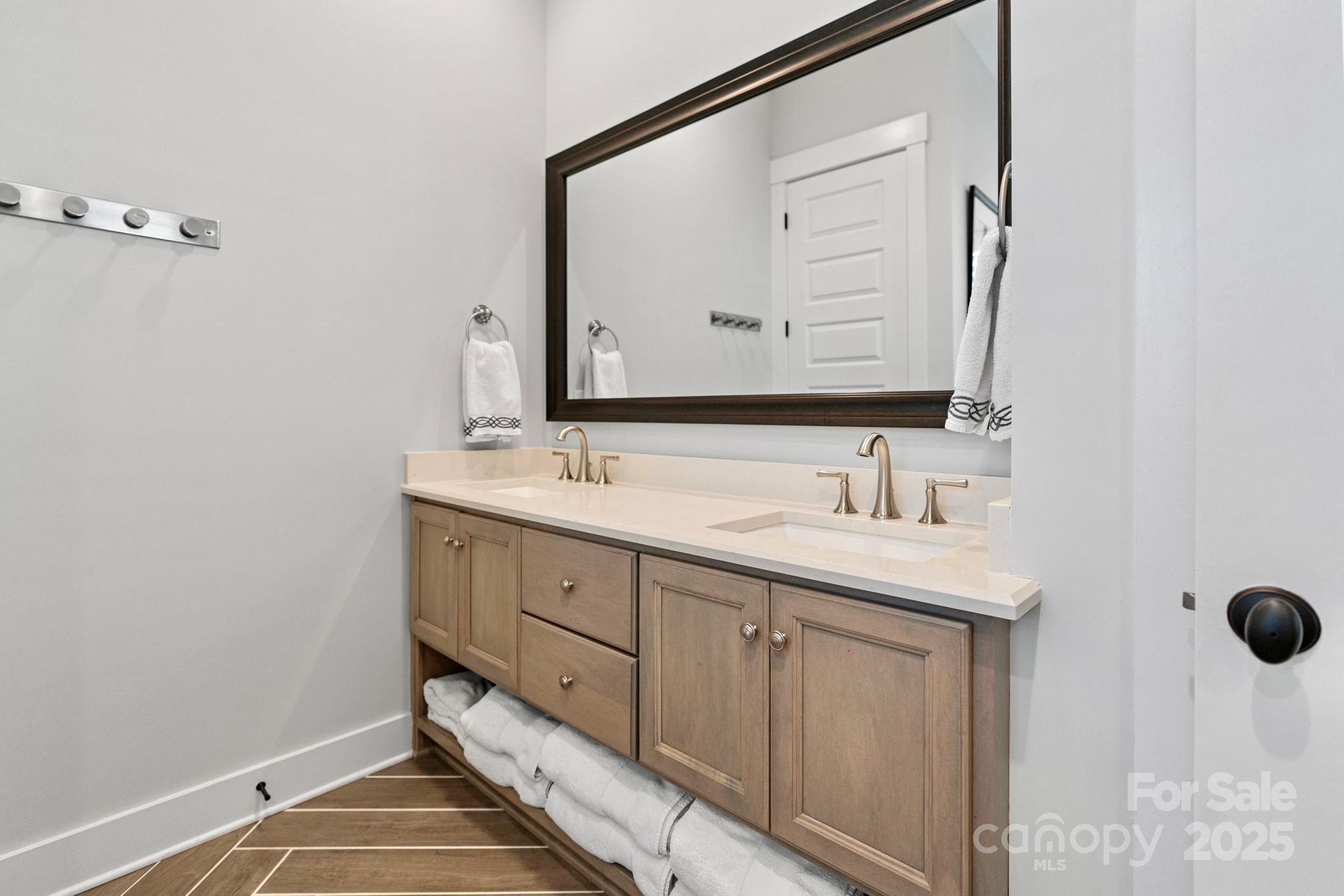 1502 Matthew McClure Circle Davidson, NC 28036 - Photo 24 of 48 a bathroom with a sink and a mirror