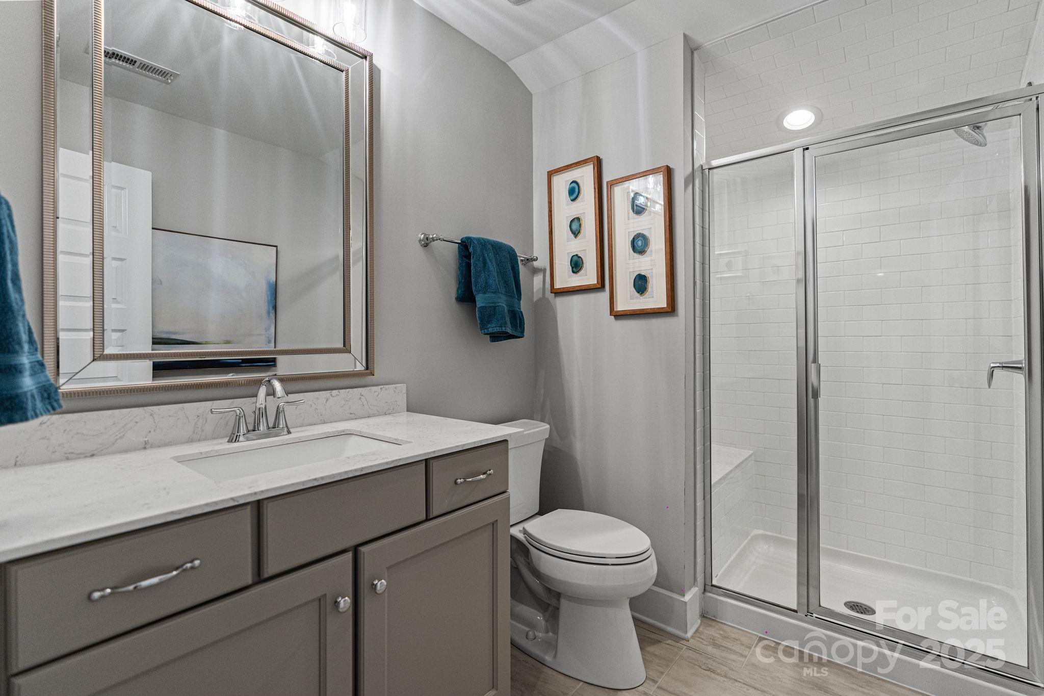 1502 Matthew McClure Circle Davidson, NC 28036 - Photo 32 of 48 a bathroom with a toilet sink and shower