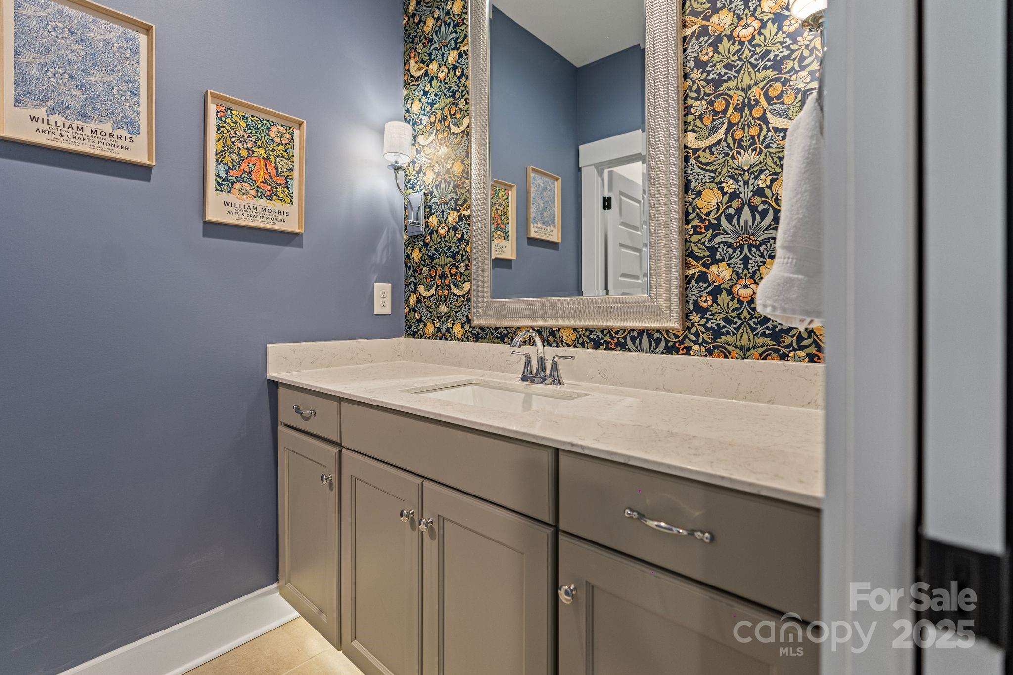 1502 Matthew McClure Circle Davidson, NC 28036 - Photo 36 of 48 a bathroom with a sink and a mirror