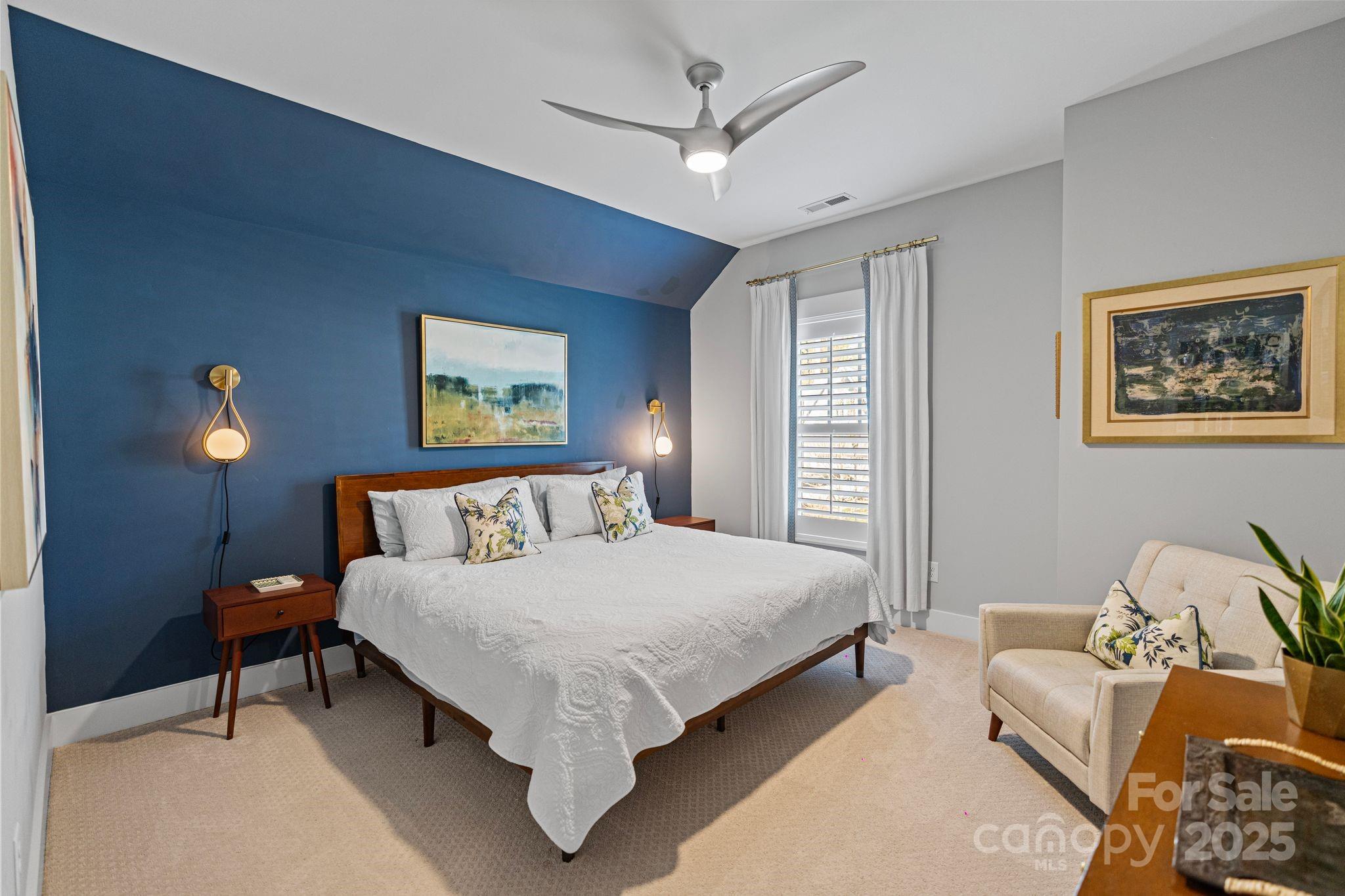 1502 Matthew McClure Circle Davidson, NC 28036 - Photo 37 of 48 a bedroom with a bed and a chandelier