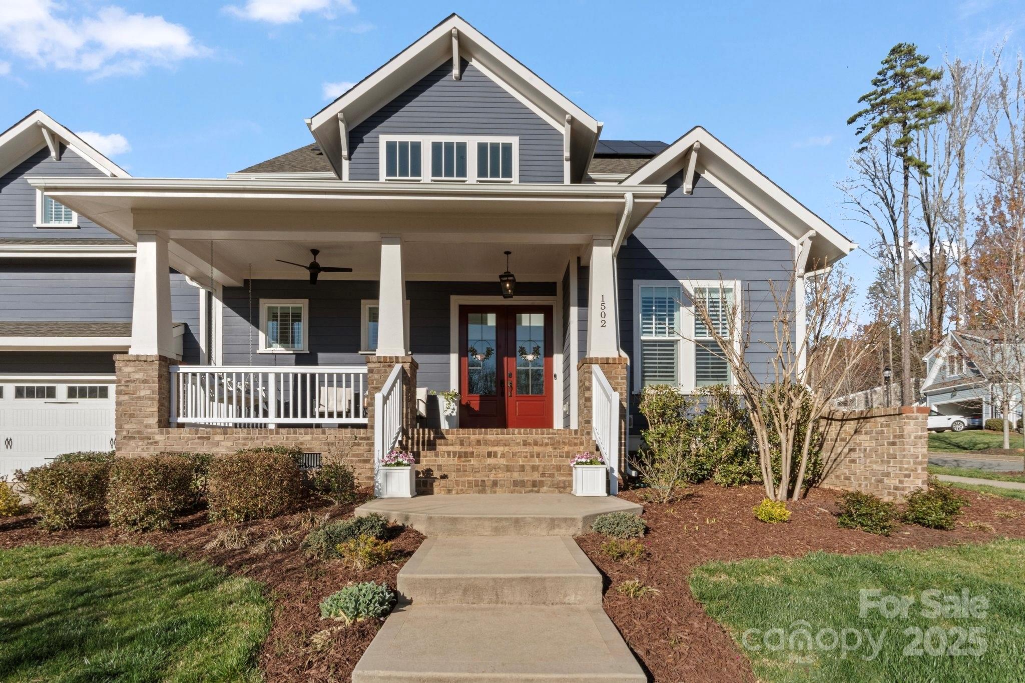 1502 Matthew McClure Circle Davidson, NC 28036 - Photo 48 of 48 a front view of a house with garden