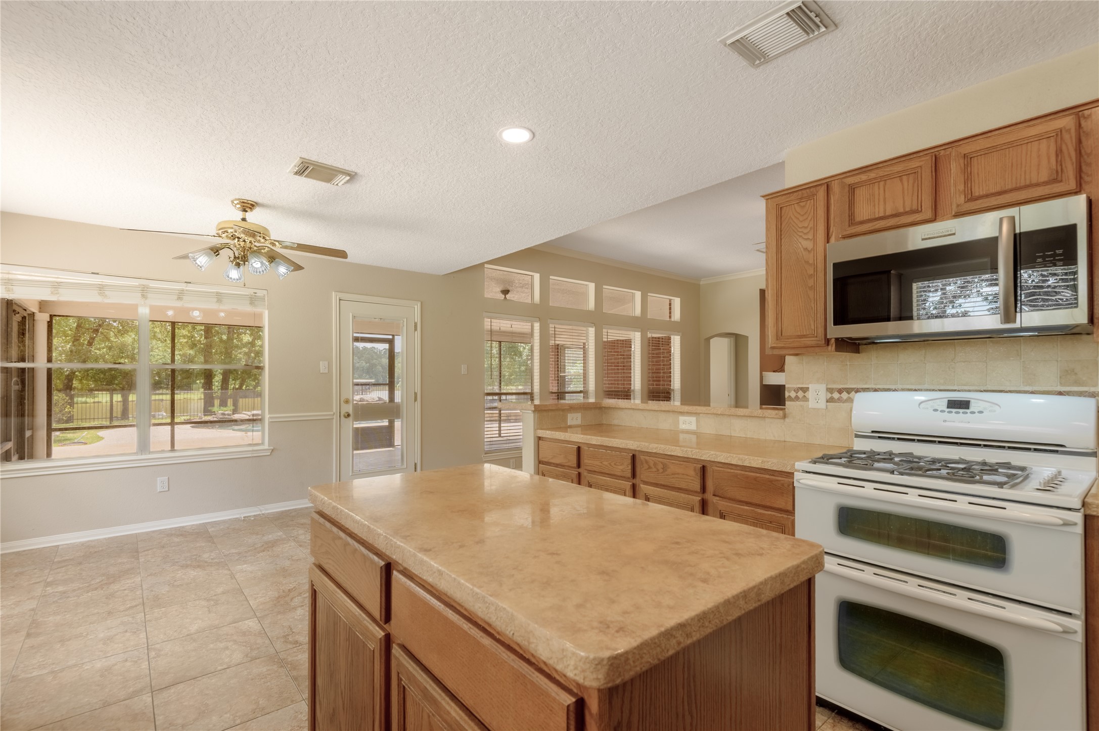324 Red Oak Lane Trinity, TX 75862 - Photo 22 of 49 a kitchen with stainless steel appliances granite countertop a stove and a sink
