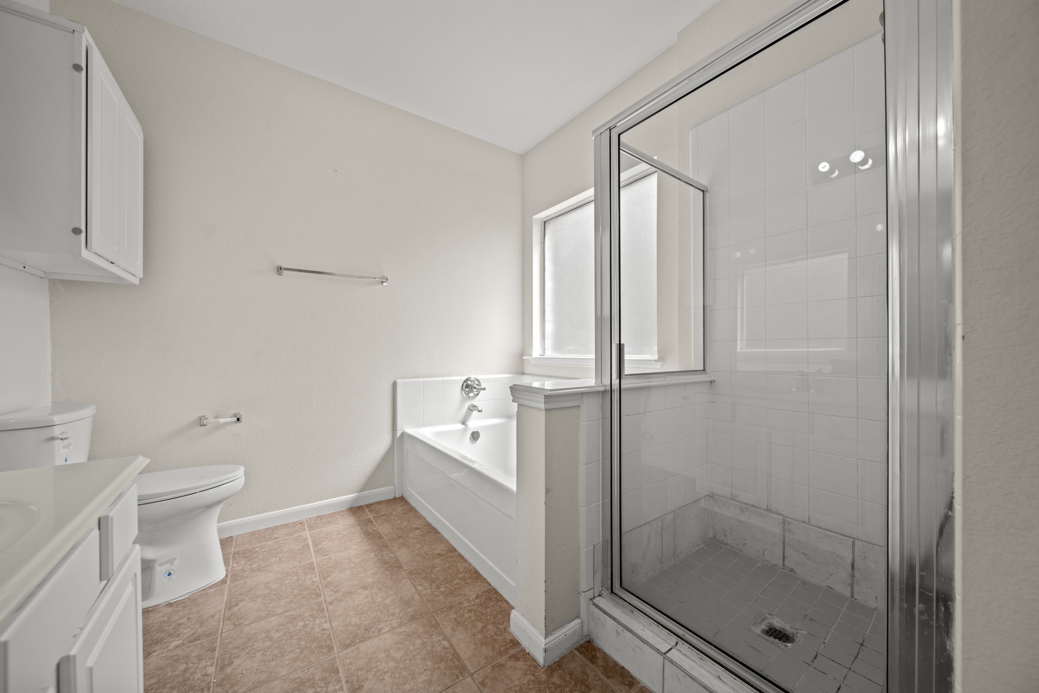 6323 Channelbrook Lane Spring, TX 77379 - Photo 11 of 24 a bathroom with a granite countertop sink a toilet and shower