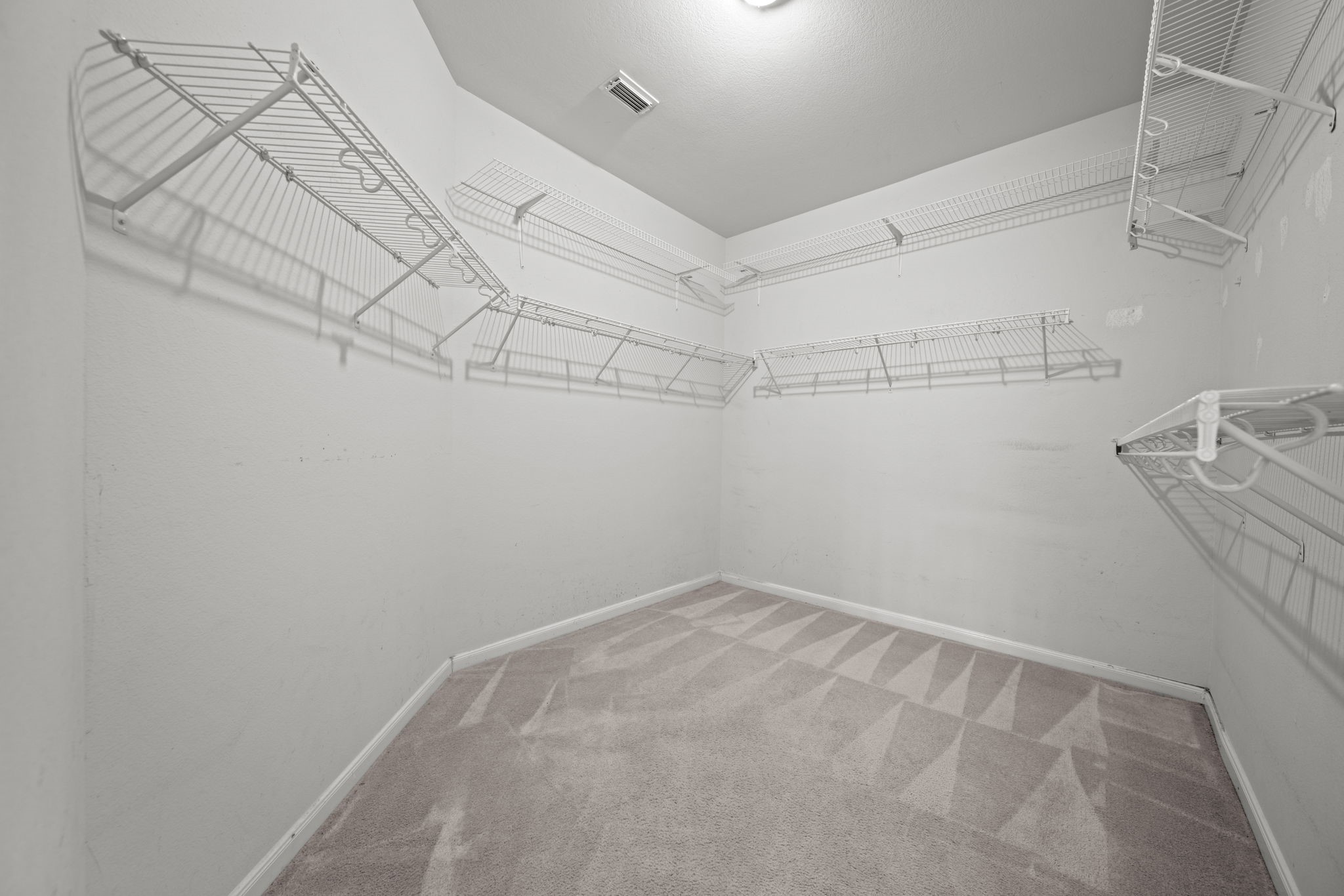 6323 Channelbrook Lane Spring, TX 77379 - Photo 12 of 24 a view of a room with racks on the wall