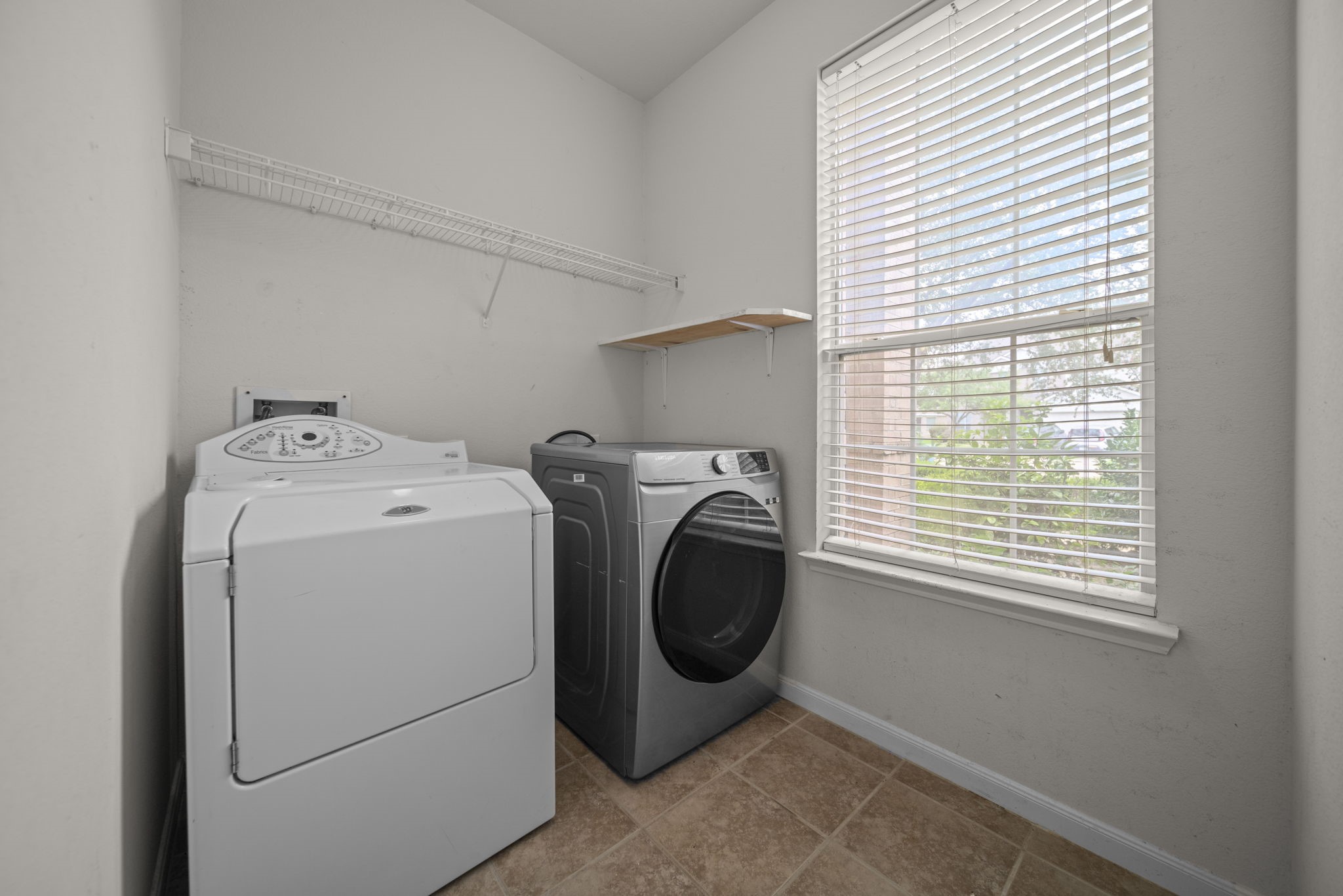 6323 Channelbrook Lane Spring, TX 77379 - Photo 22 of 24 a utility room with dryer and washer