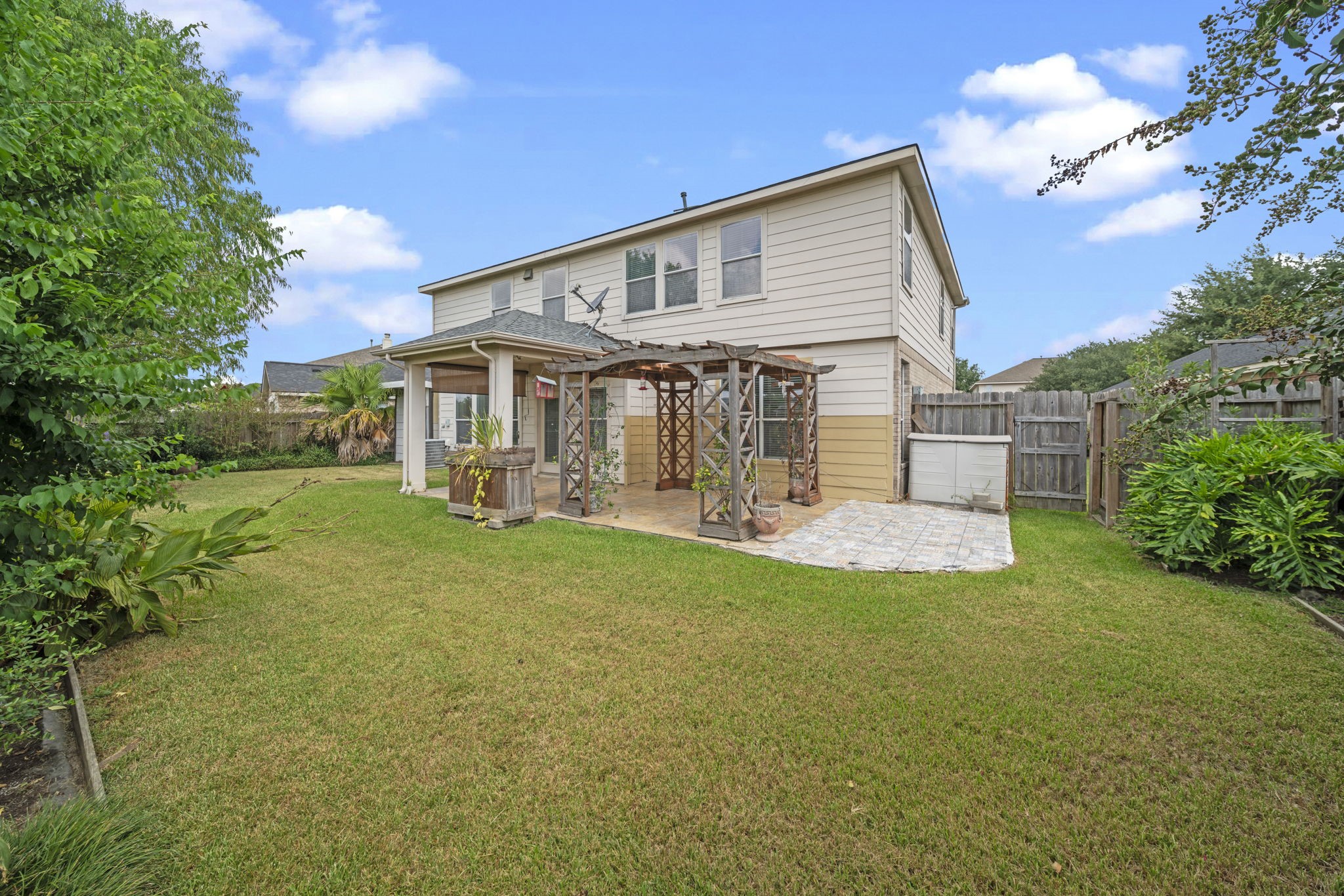 6323 Channelbrook Lane Spring, TX 77379 - Photo 23 of 24 a front view of a house with garden