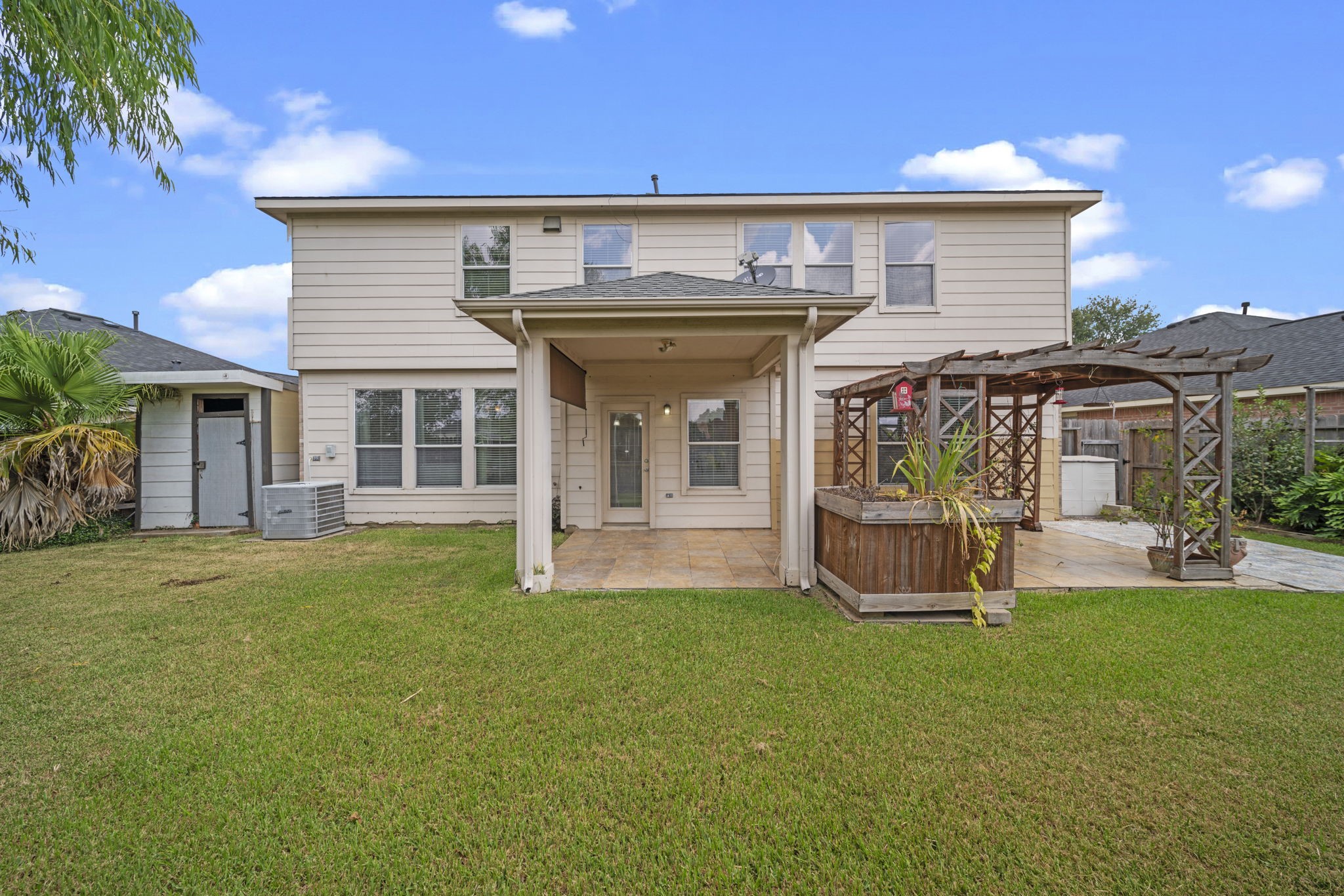 6323 Channelbrook Lane Spring, TX 77379 - Photo 24 of 24 a view of a house with a yard and sitting area