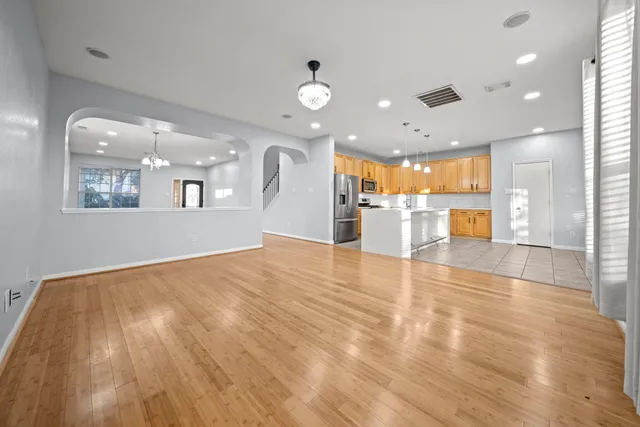 a view of an entryway with wooden floor and stairs