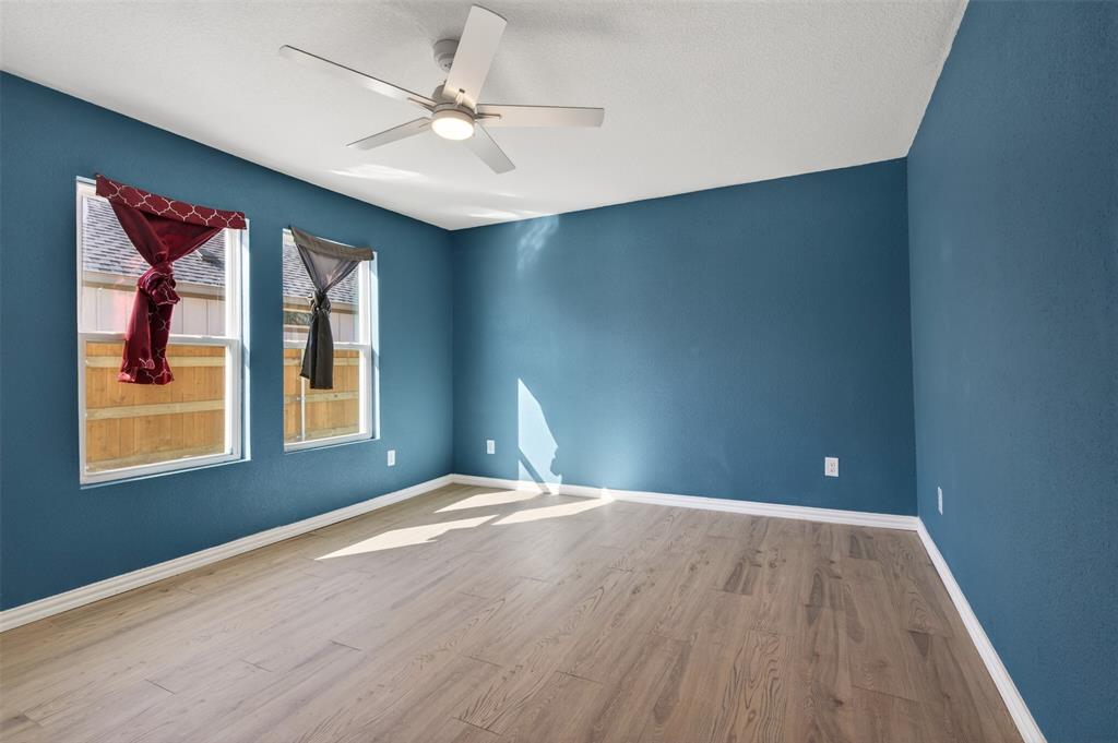 603 East Willingham Street Cleburne, TX 76031 - Photo 14 of 25 a bedroom with a bed and a window