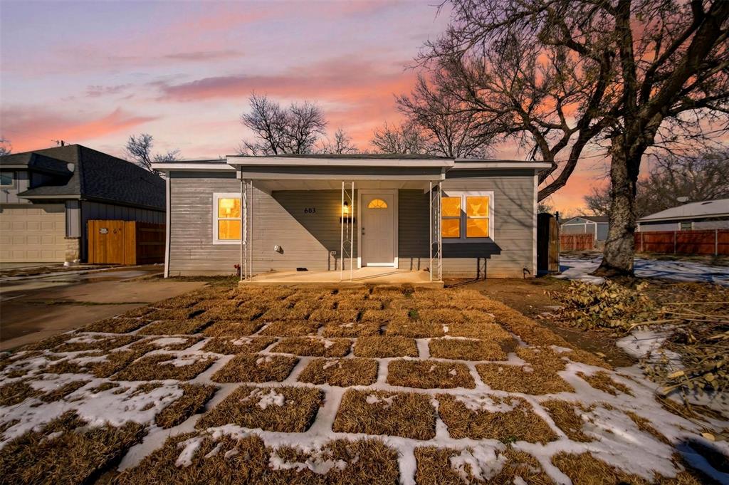 603 East Willingham Street Cleburne, TX 76031 - Photo 25 of 25 a front view of a house with a yard