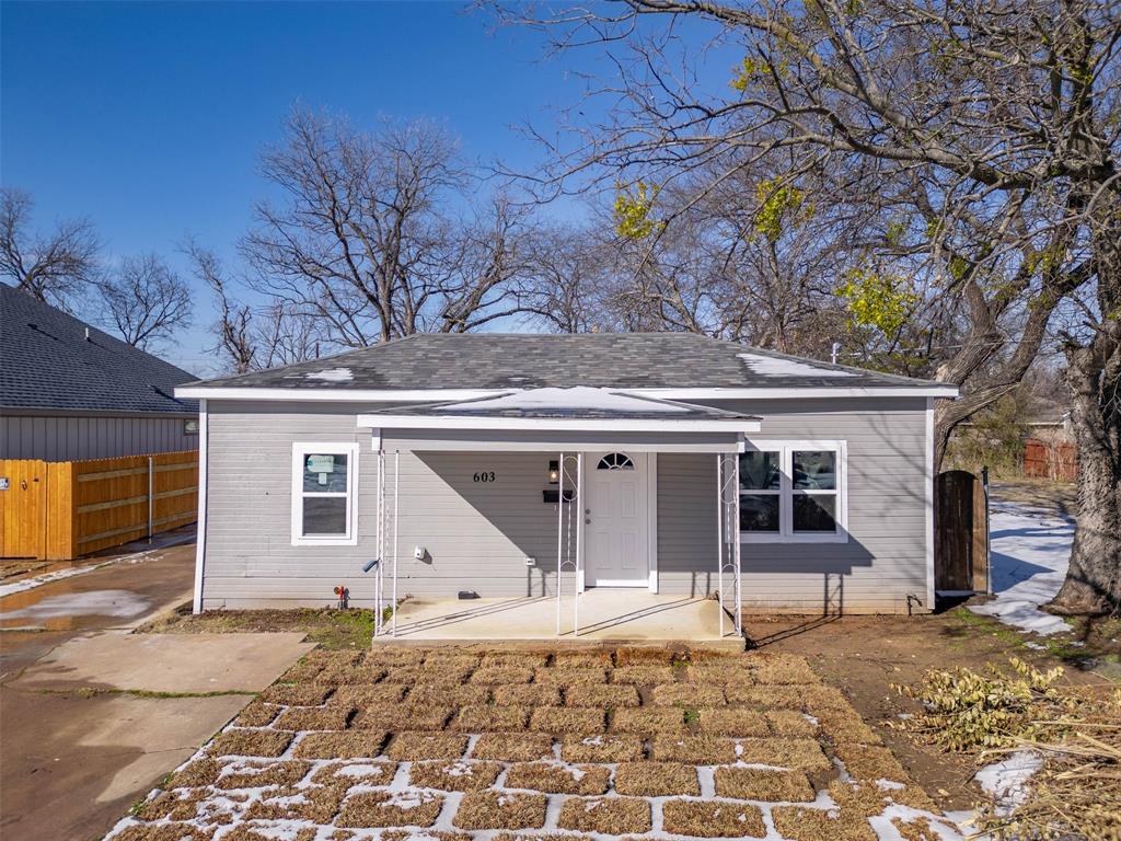 603 East Willingham Street Cleburne, TX 76031 - Photo 4 of 25 a house that has a tree in front of it