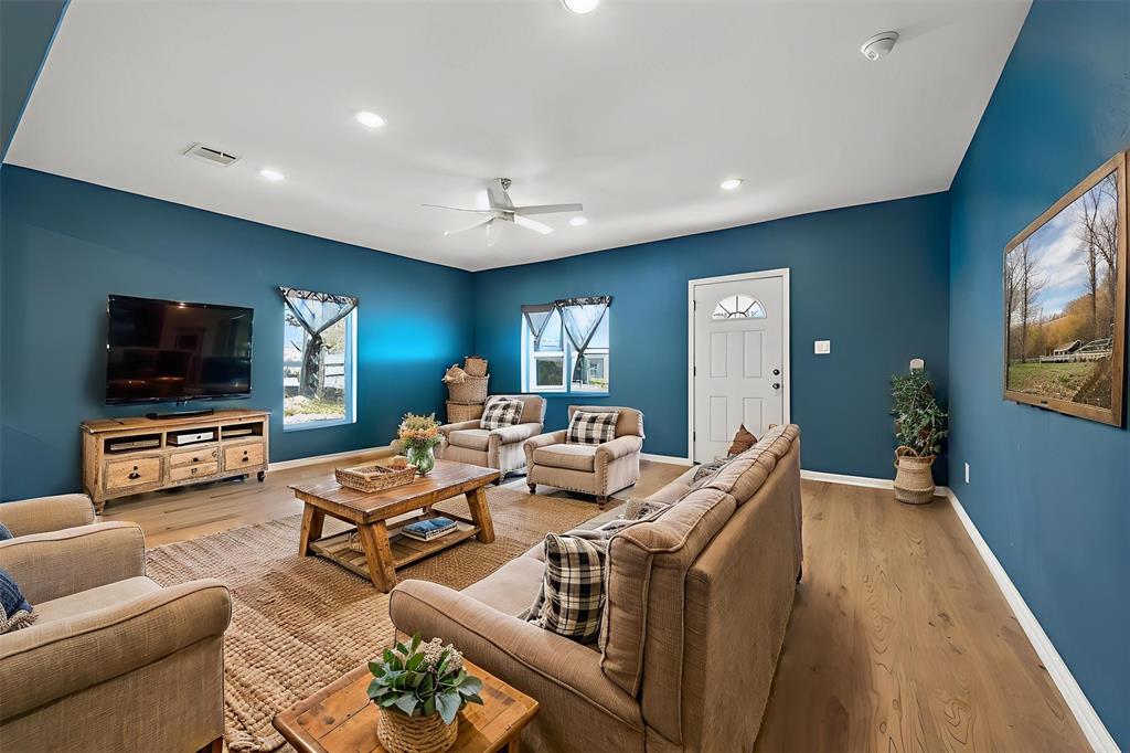 603 East Willingham Street Cleburne, TX 76031 - Photo 7 of 25 a living room with furniture and a flat screen tv
