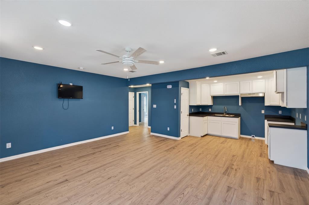 603 East Willingham Street Cleburne, TX 76031 - Photo 9 of 25 a view of a kitchen with microwave and cabinets