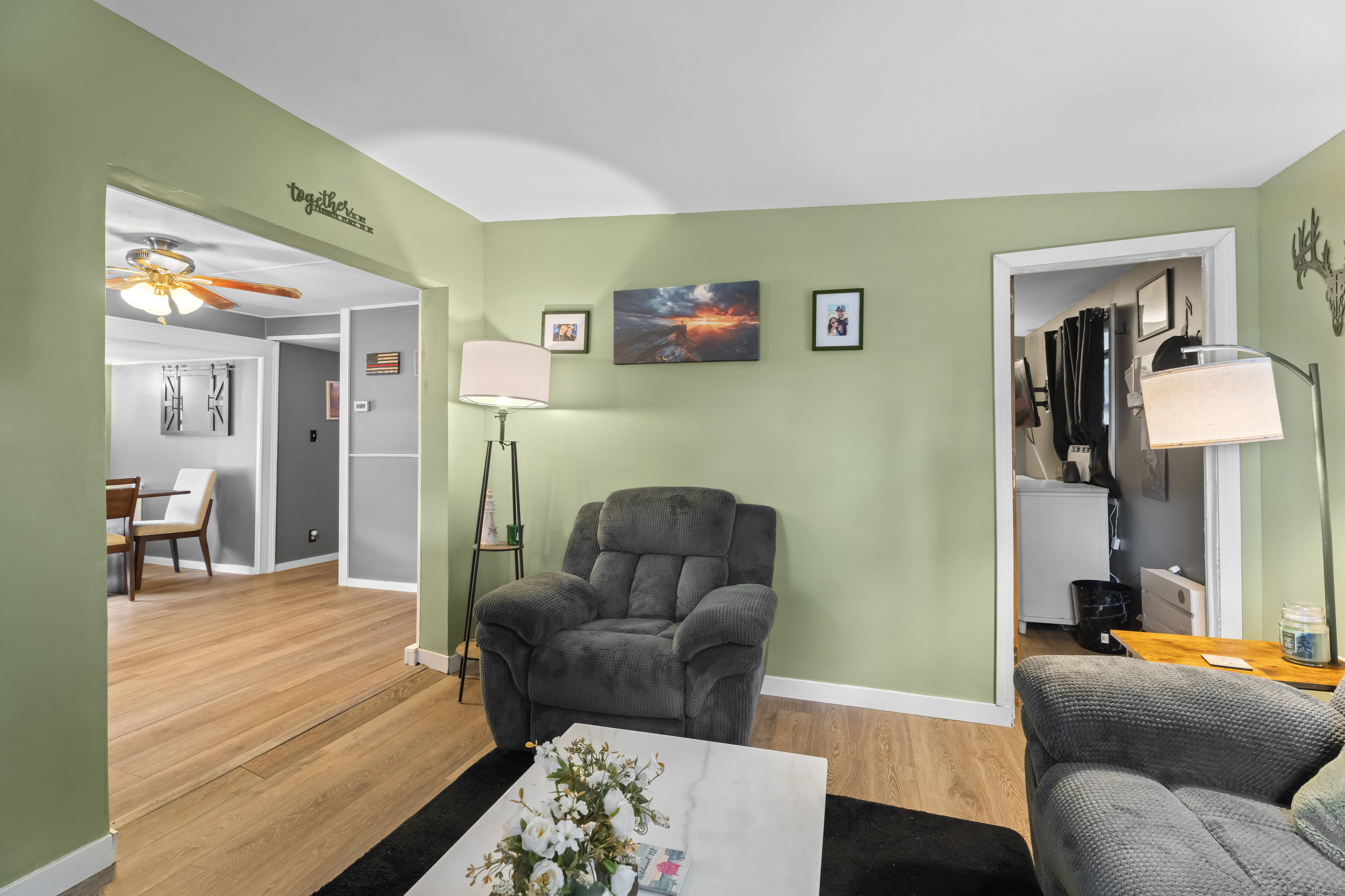 133 West Main Street, Unit MV1 Clinton, CT 06413 - Photo 11 of 36 a living room with furniture and a wooden floor