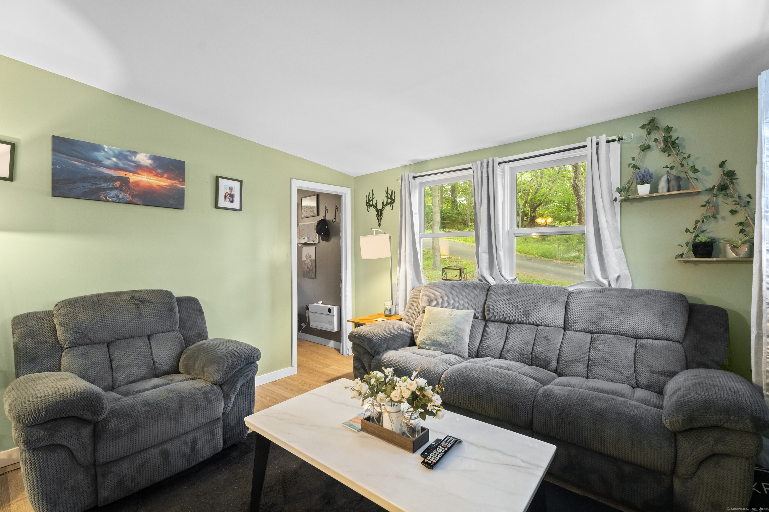133 West Main Street, Unit MV1 Clinton, CT 06413 - Photo 12 of 36 a living room with furniture couches and a large window
