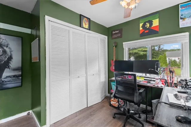 a work room with furniture and a window