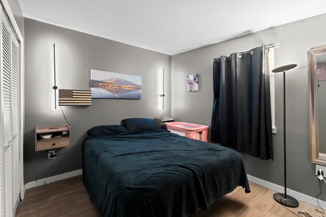 a bedroom with a bed and a closet