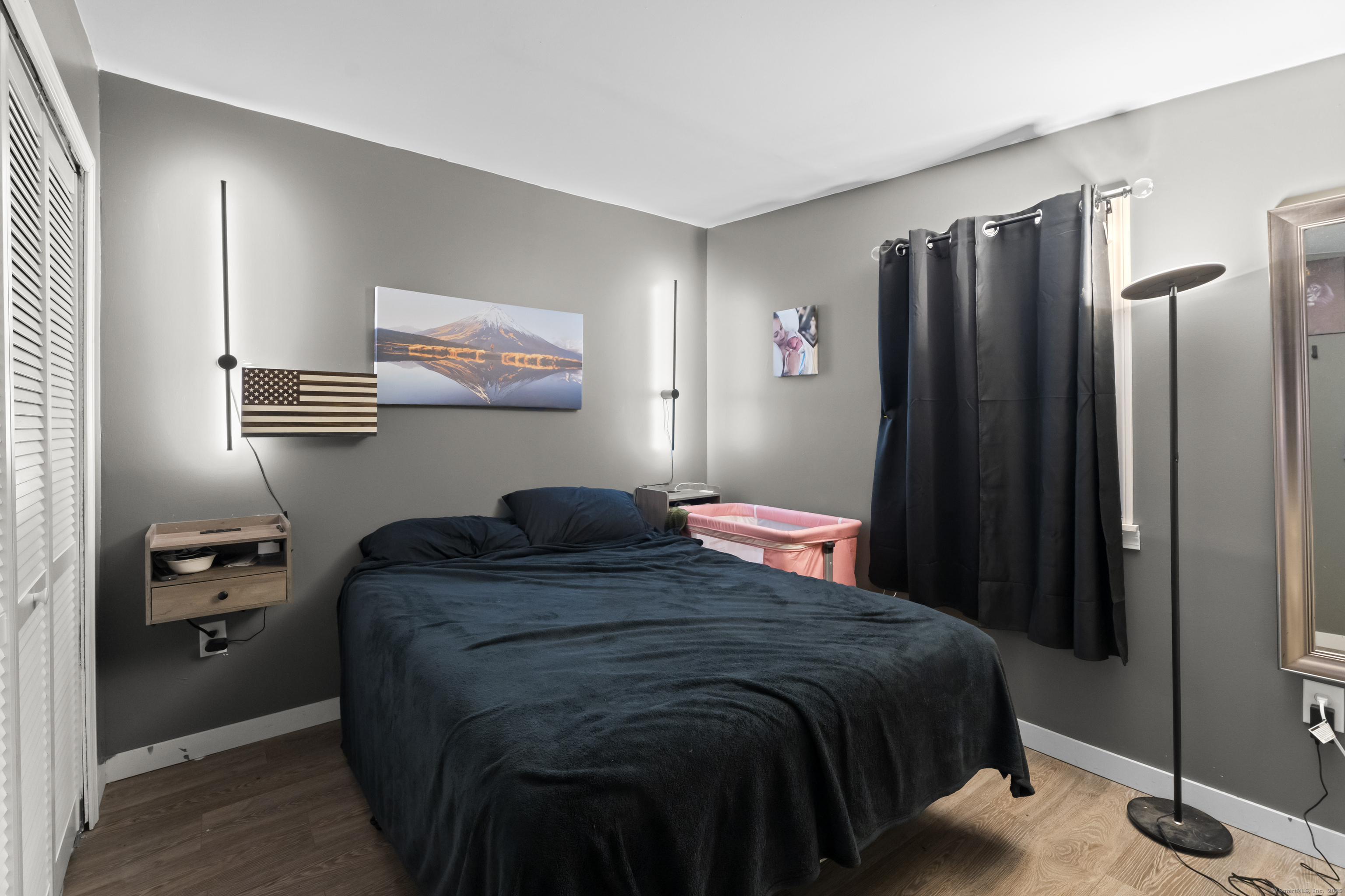 133 West Main Street, Unit MV1 Clinton, CT 06413 - Photo 17 of 36 a bedroom with a bed and a closet