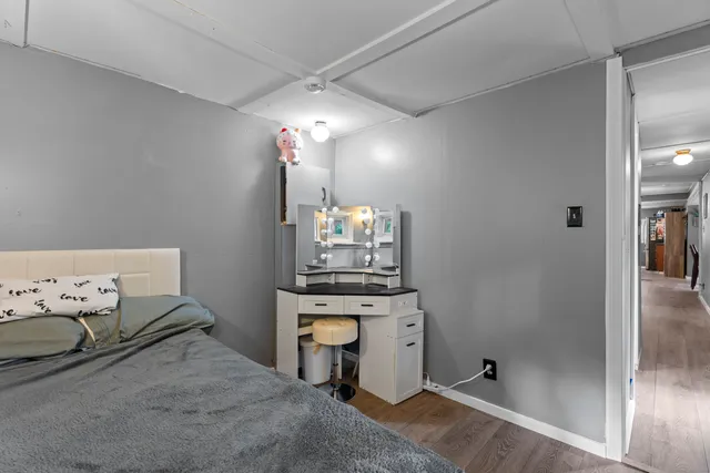 a room with kitchen island a chandelier furniture and a chandelier