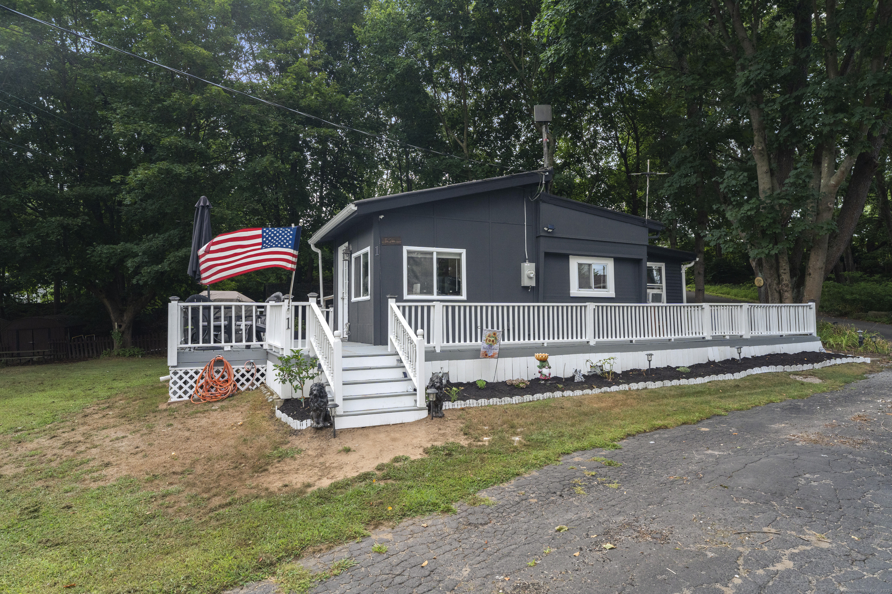 133 West Main Street, Unit MV1 Clinton, CT 06413 - Photo 26 of 36 a front view of a house with a yard