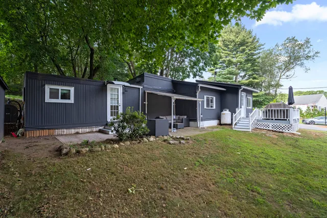 a front view of house with yard and seating area
