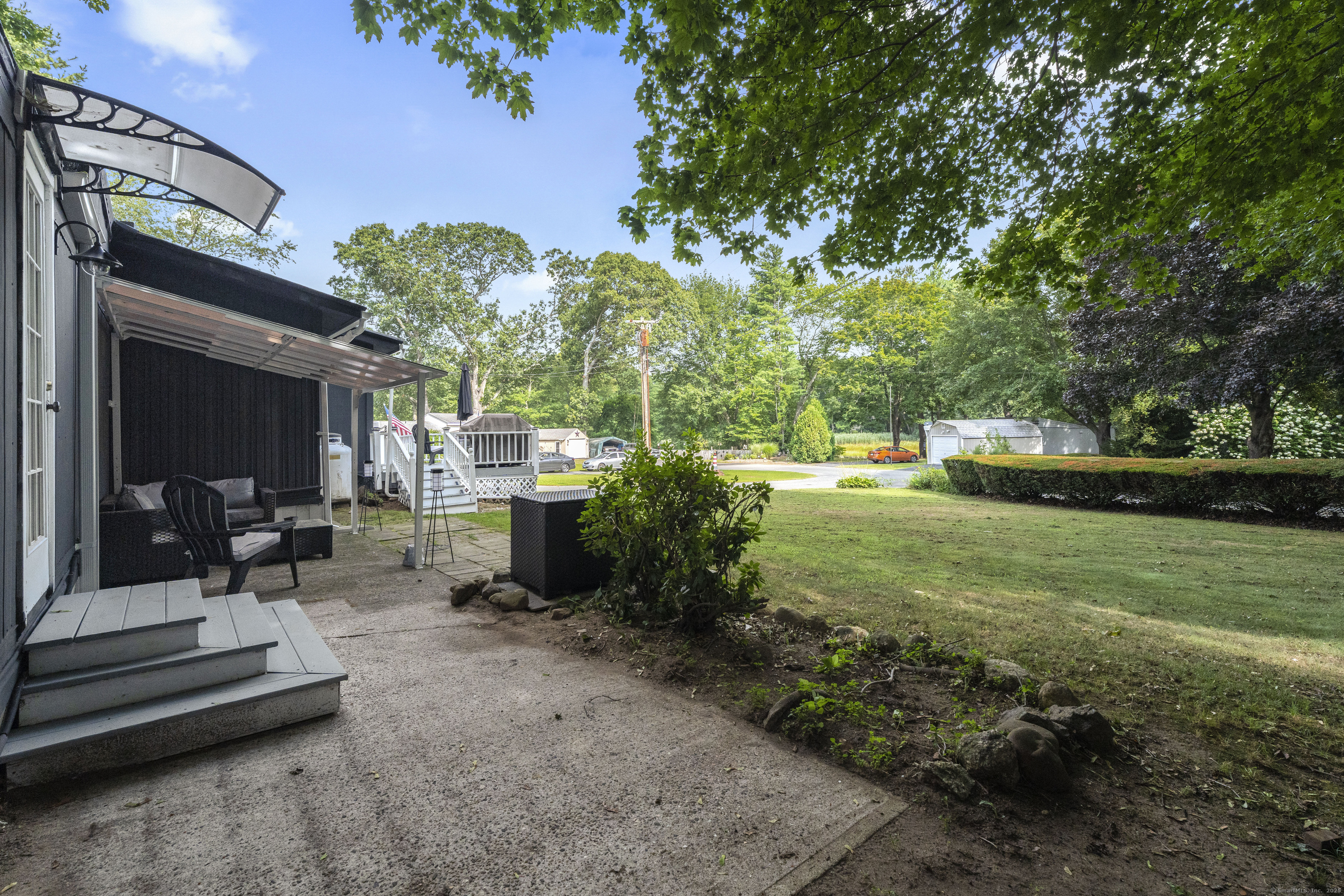 133 West Main Street, Unit MV1 Clinton, CT 06413 - Photo 31 of 36 a view of a house with backyard and sitting area