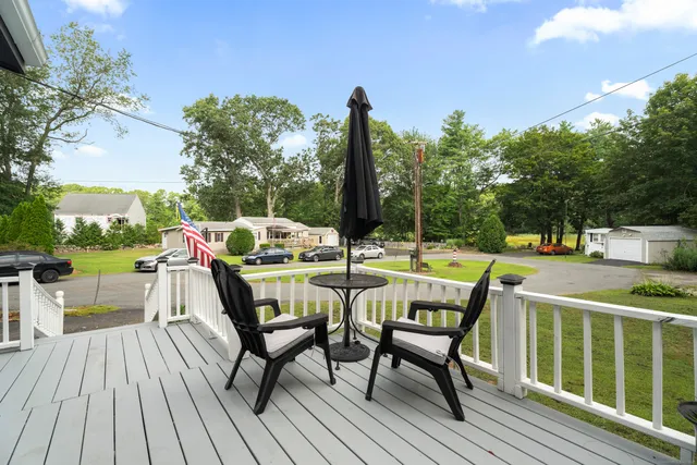 a view of a chairs and table on the deck