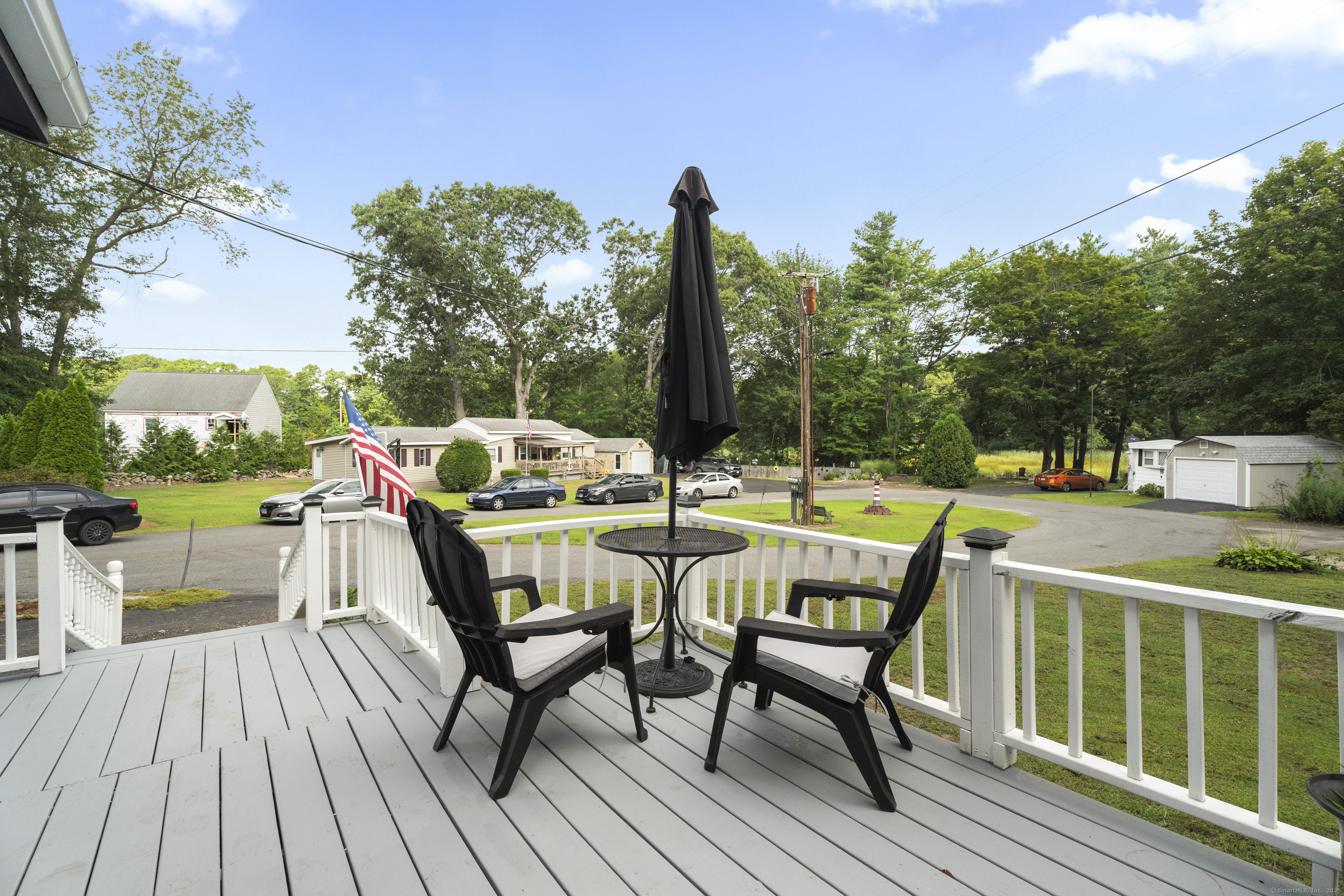 133 West Main Street, Unit MV1 Clinton, CT 06413 - Photo 33 of 36 a view of a chairs and table on the deck