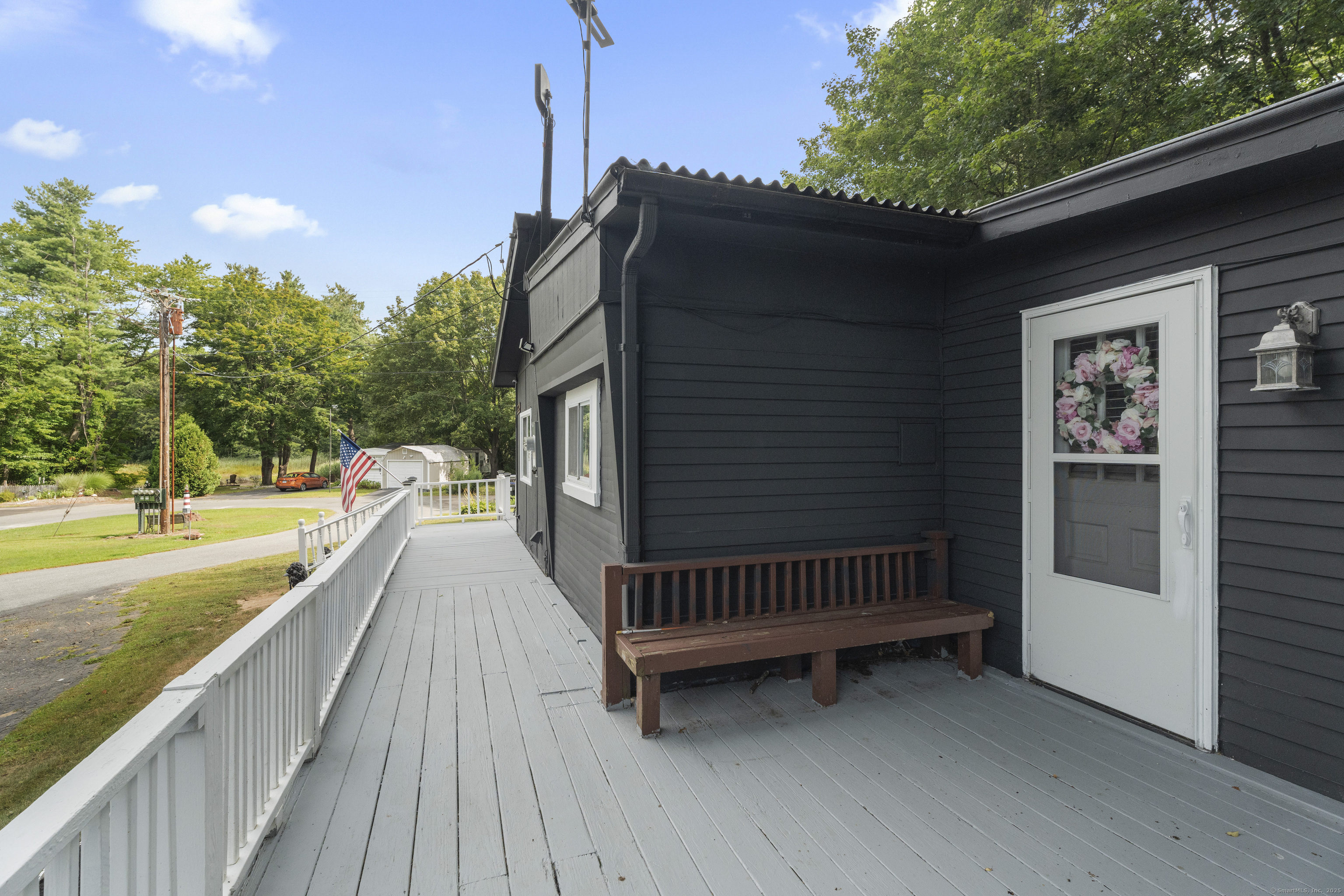 133 West Main Street, Unit MV1 Clinton, CT 06413 - Photo 34 of 36 a view of balcony with wooden floor and outdoor seating