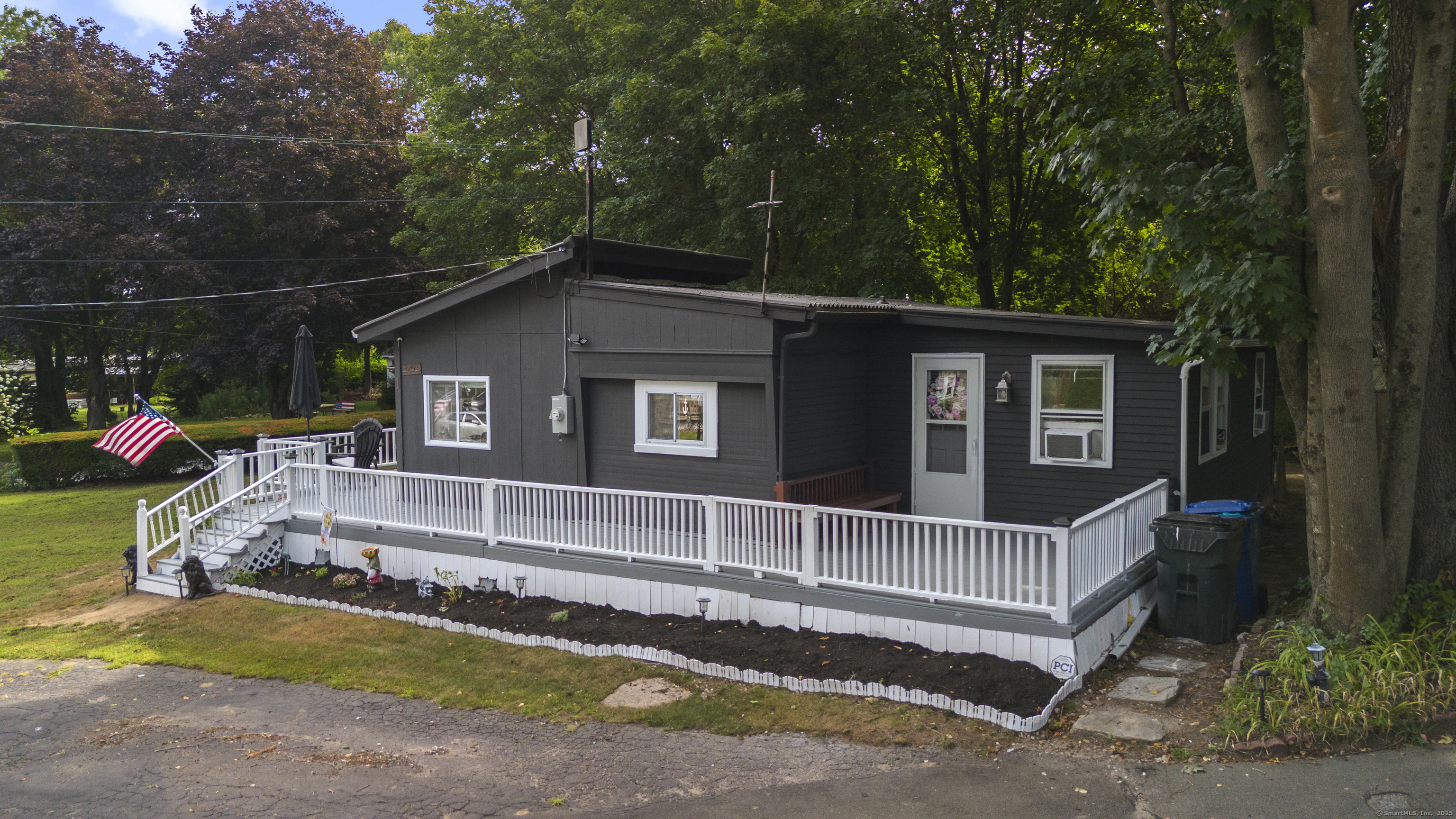 133 West Main Street, Unit MV1 Clinton, CT 06413 - Photo 4 of 36 a house with trees in the background