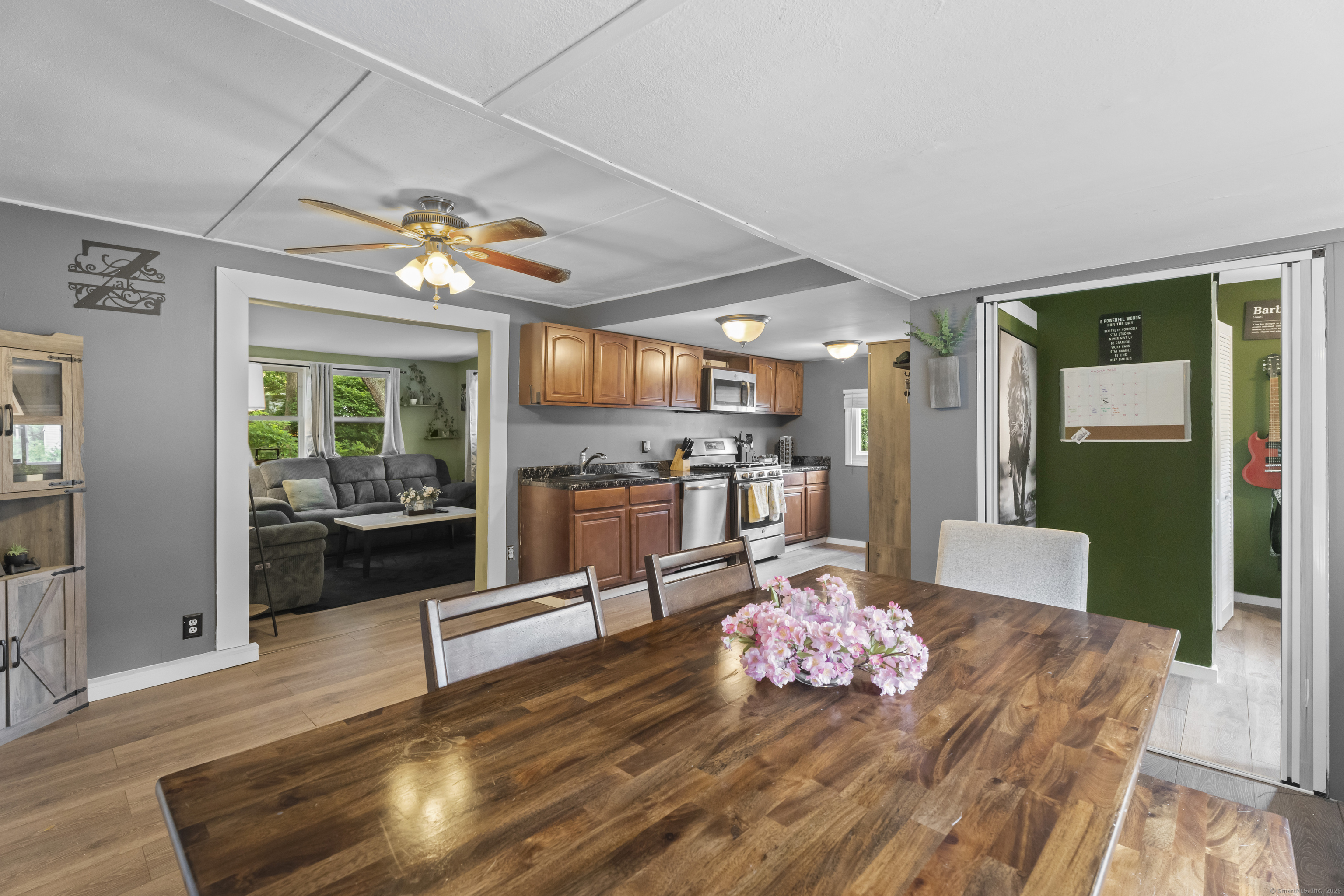 133 West Main Street, Unit MV1 Clinton, CT 06413 - Photo 6 of 36 a living room with furniture and a large window