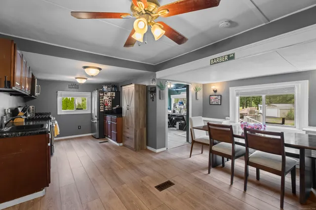 a view of a dining room with furniture window and wooden floor