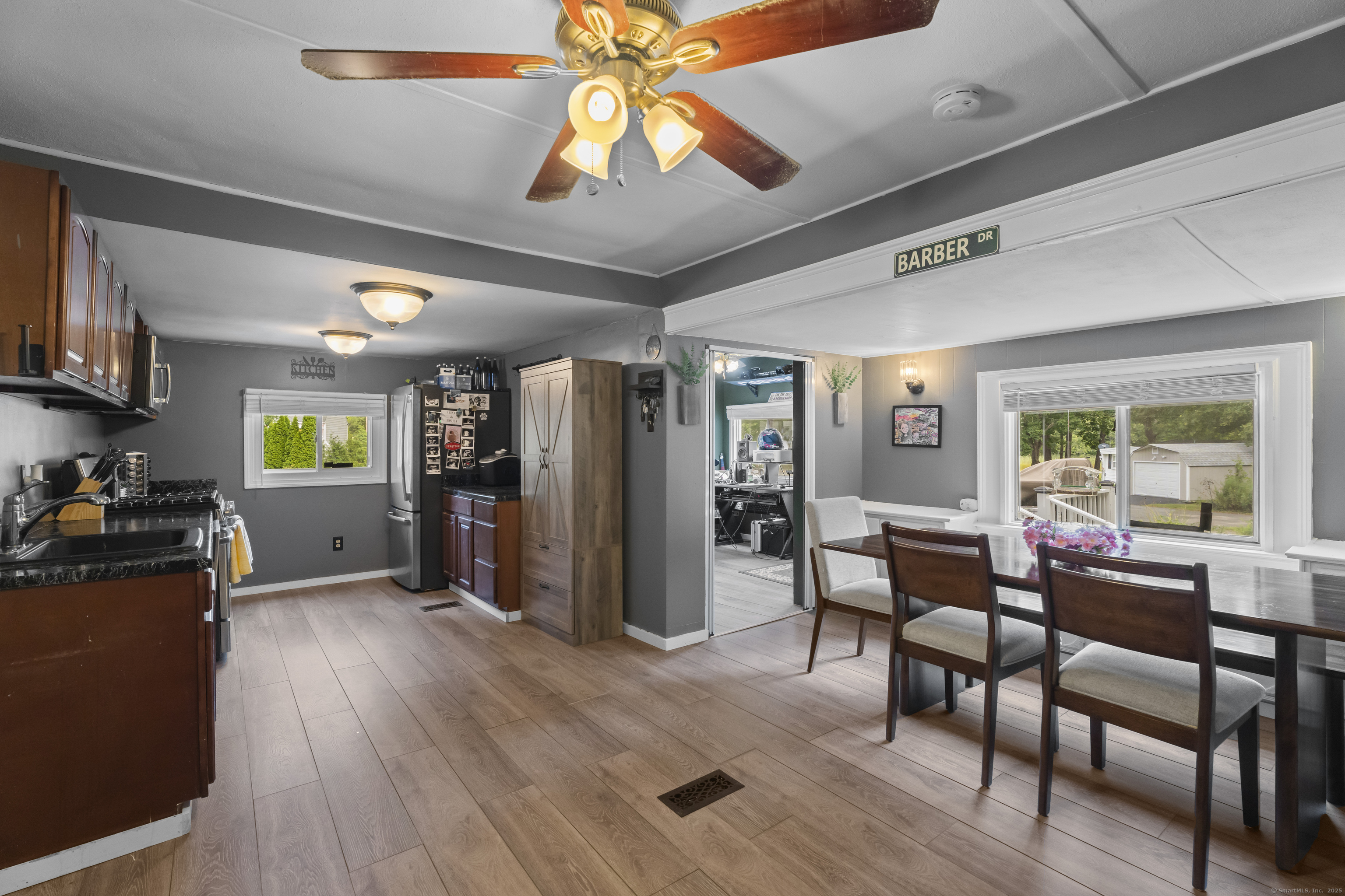 133 West Main Street, Unit MV1 Clinton, CT 06413 - Photo 8 of 36 a view of a dining room with furniture window and wooden floor