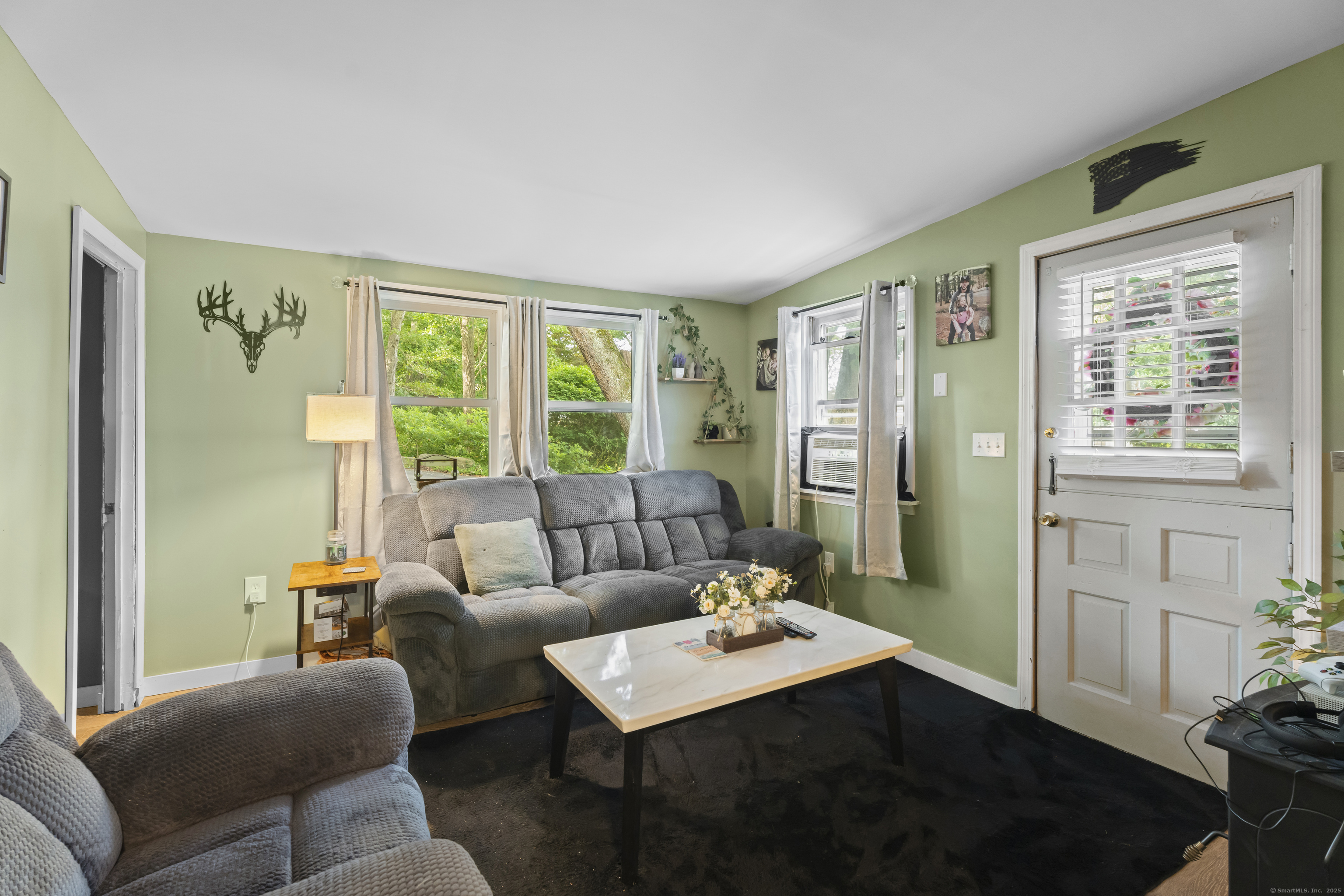 133 West Main Street, Unit MV1 Clinton, CT 06413 - Photo 10 of 36 a living room with furniture and a large window