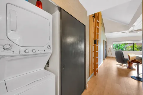 a view of kitchen with furniture and wooden floor