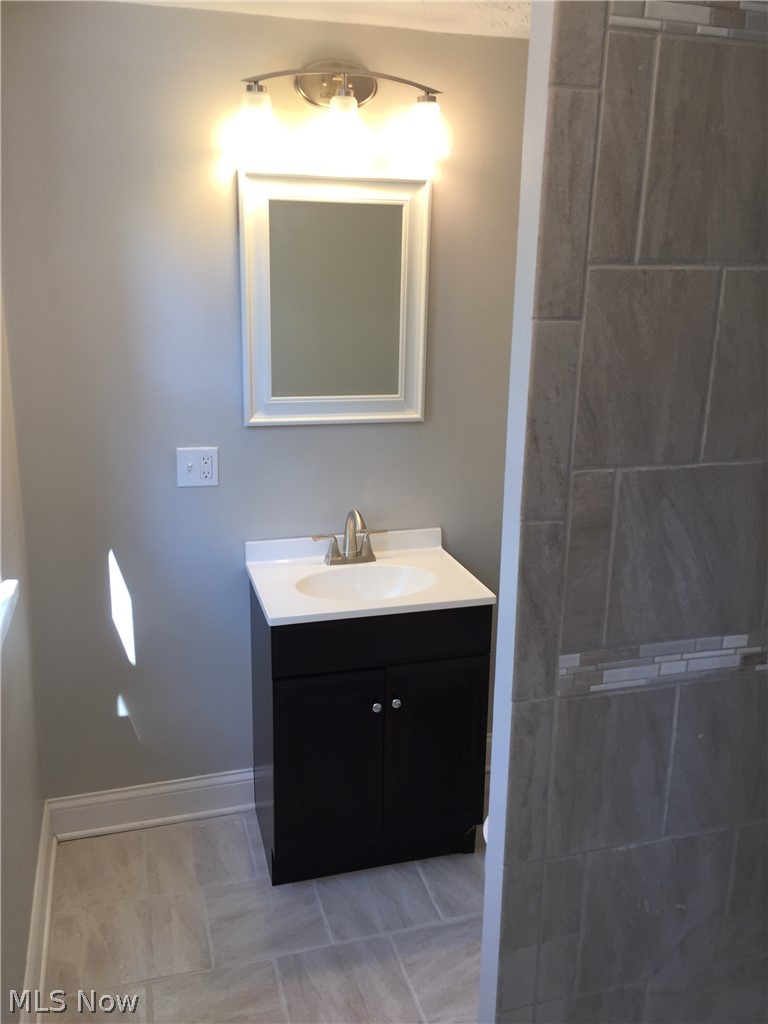 1752 South Taylor Road Cleveland, OH 44118 - Photo 10 of 14 Bathroom featuring tile flooring and vanity