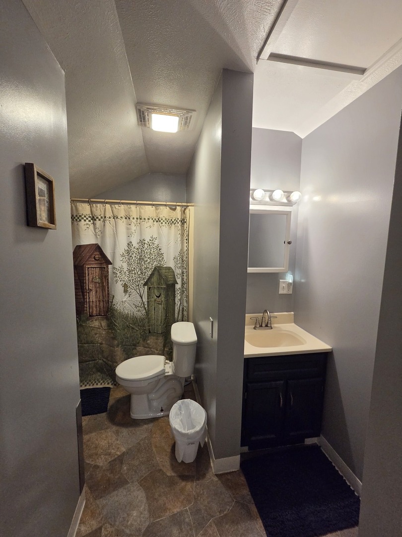 1000 West McKinley Road Ottawa, IL 61350 - Photo 13 of 19 a bathroom with a toilet sink and mirror