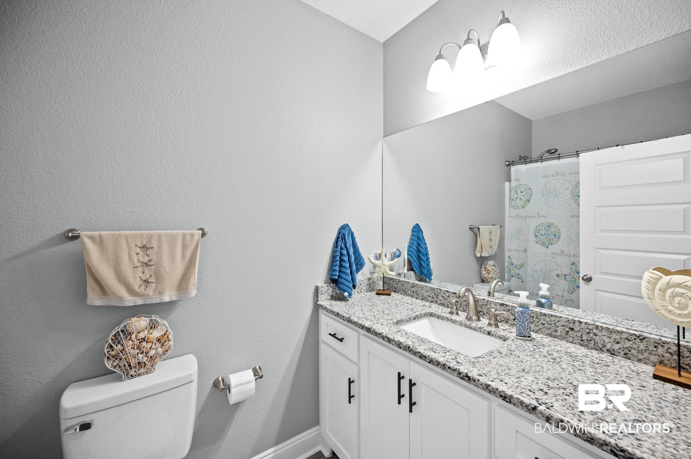 1700 South Juniper Street Foley, AL 36535 - Photo 31 of 51 Bathroom with walk in shower, vanity, and toilet