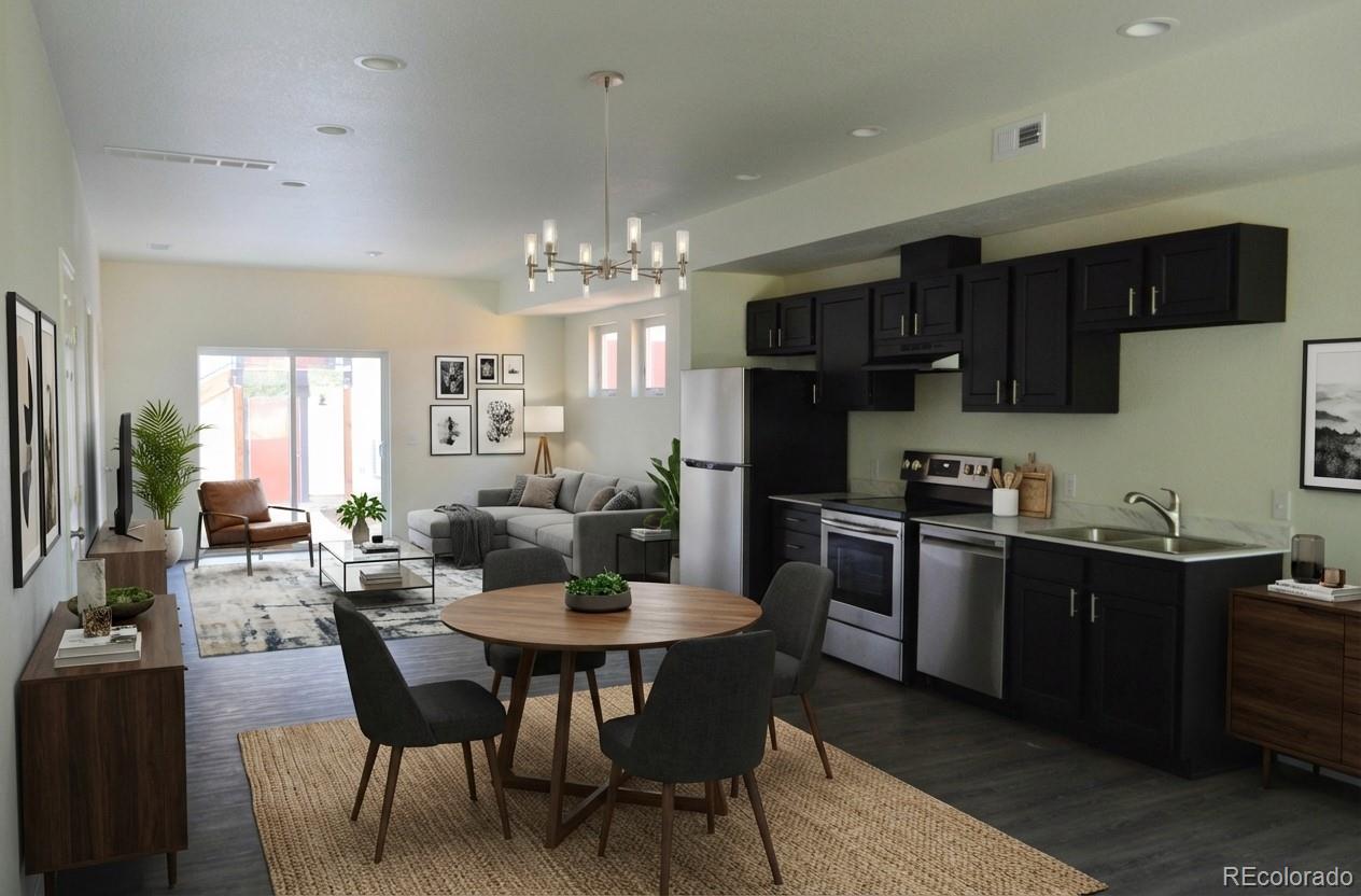 a kitchen with a dining table chairs stainless steel appliances and cabinets