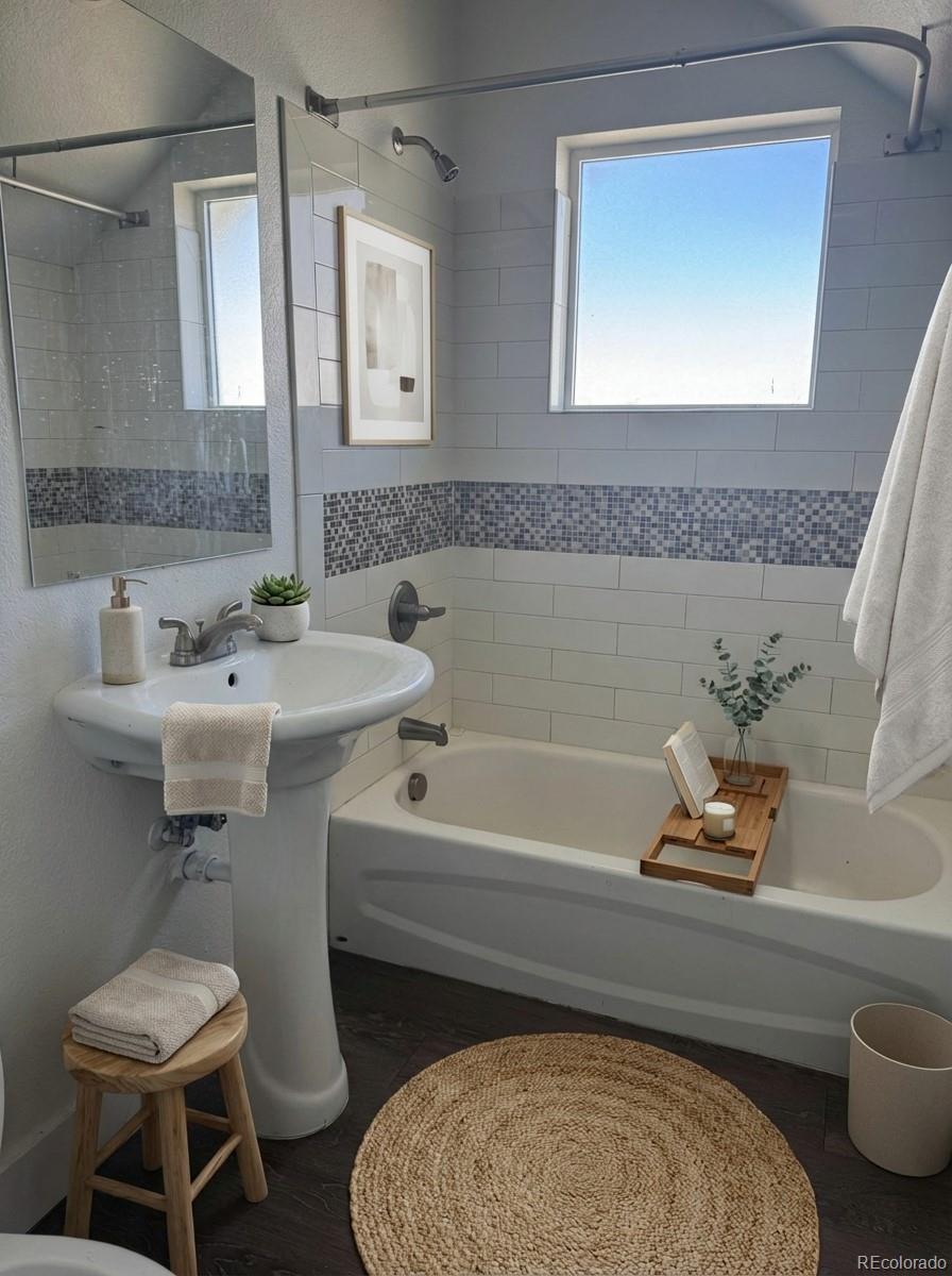 2931 North Williams Street Denver, CO 80205 - Photo 3 of 12 a bathroom with a sink and a mirror
