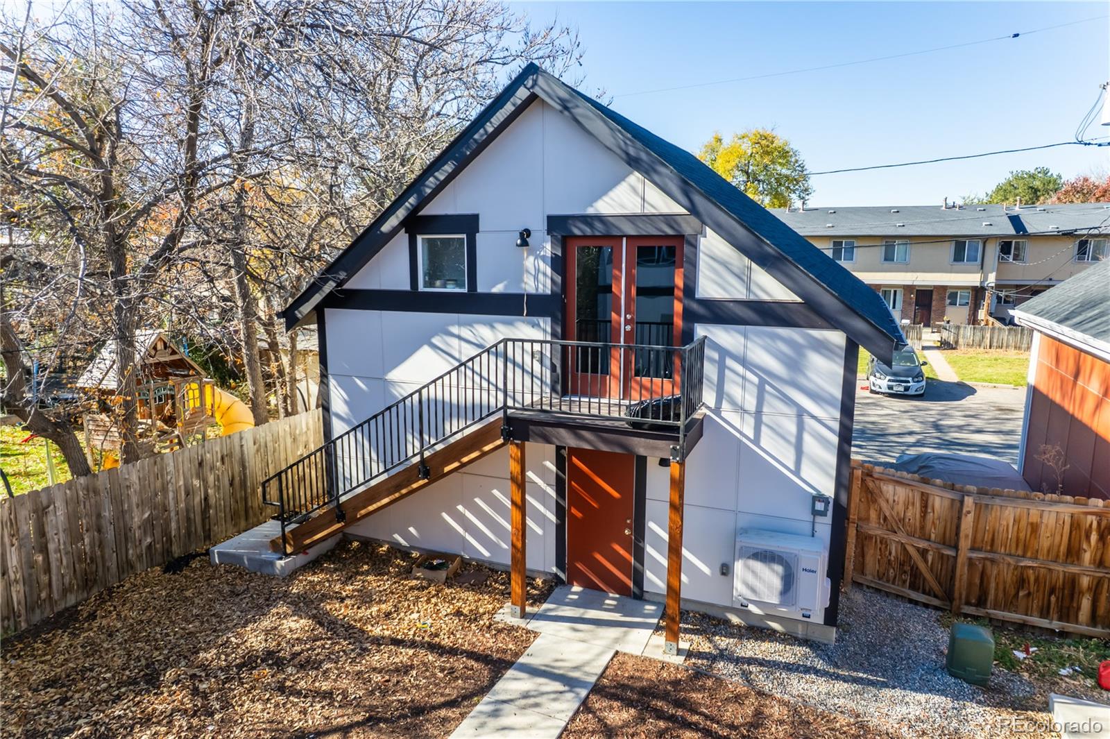 2931 North Williams Street Denver, CO 80205 - Photo 10 of 12 a view of a house with wooden fence