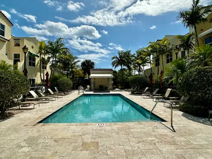 a view of a swimming pool with a lounge chairs